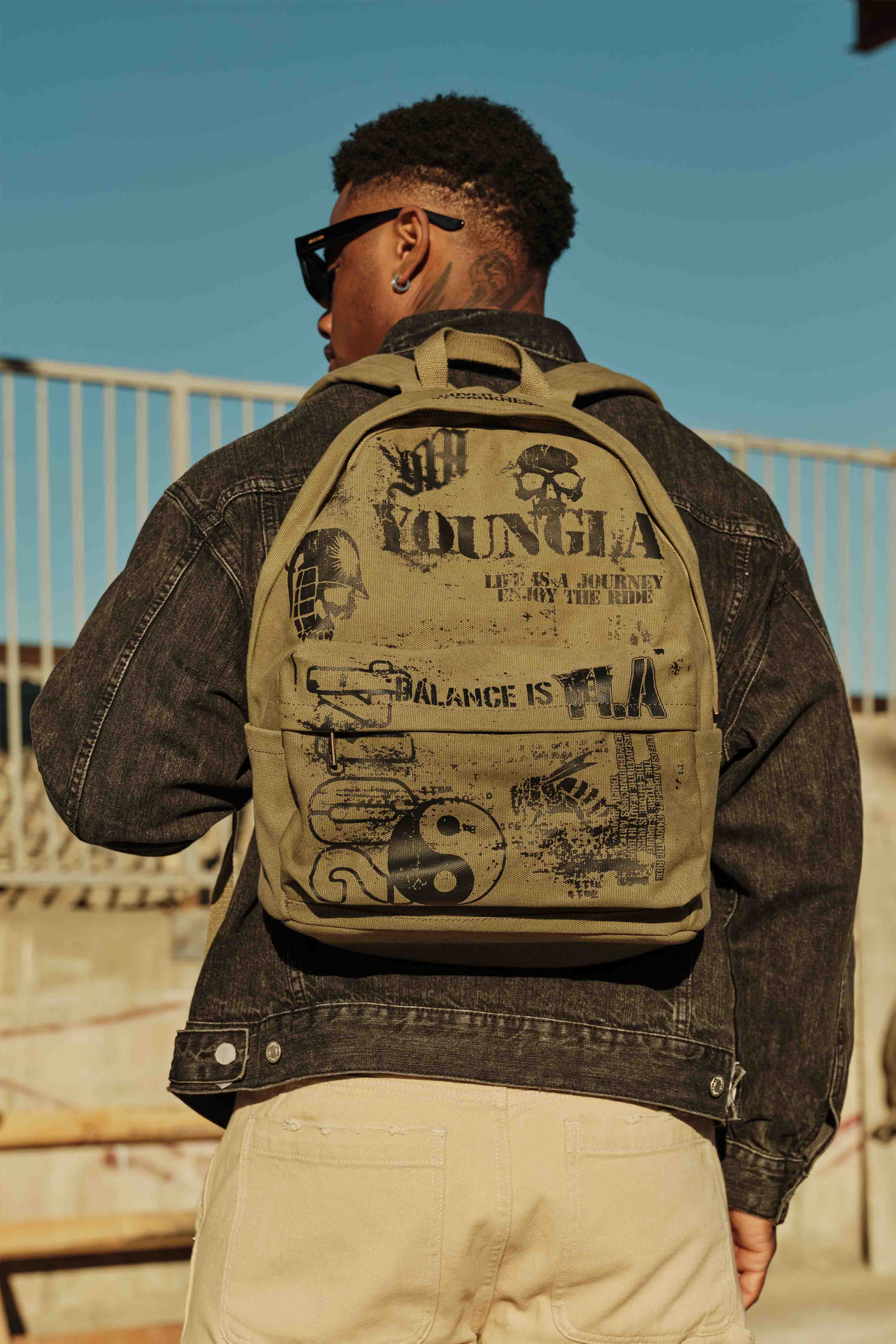 Side angle showing the spacious compartments of the tactical sling backpack.