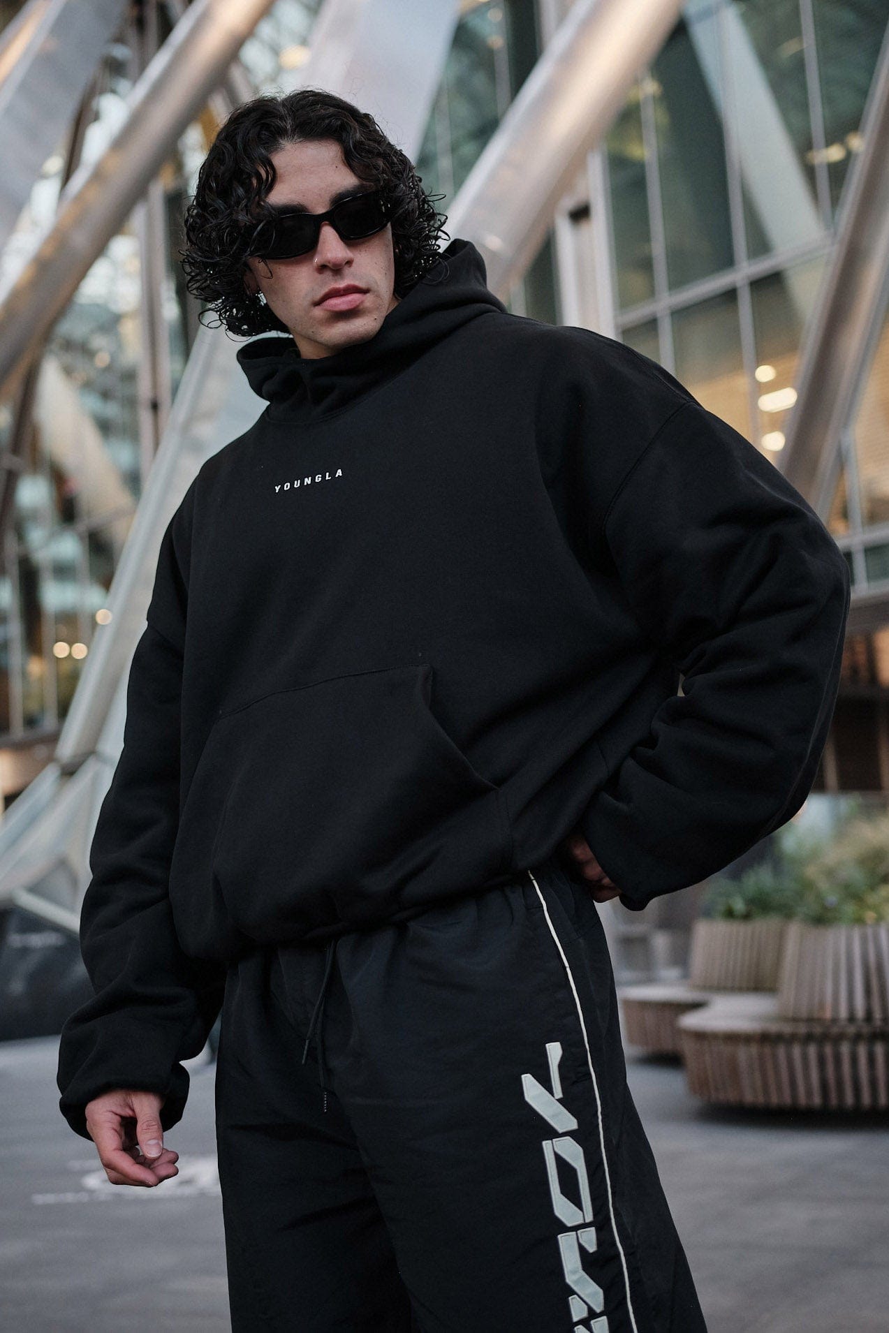 Back angle of the oversized zip up hoodie showing its unique round silhouette