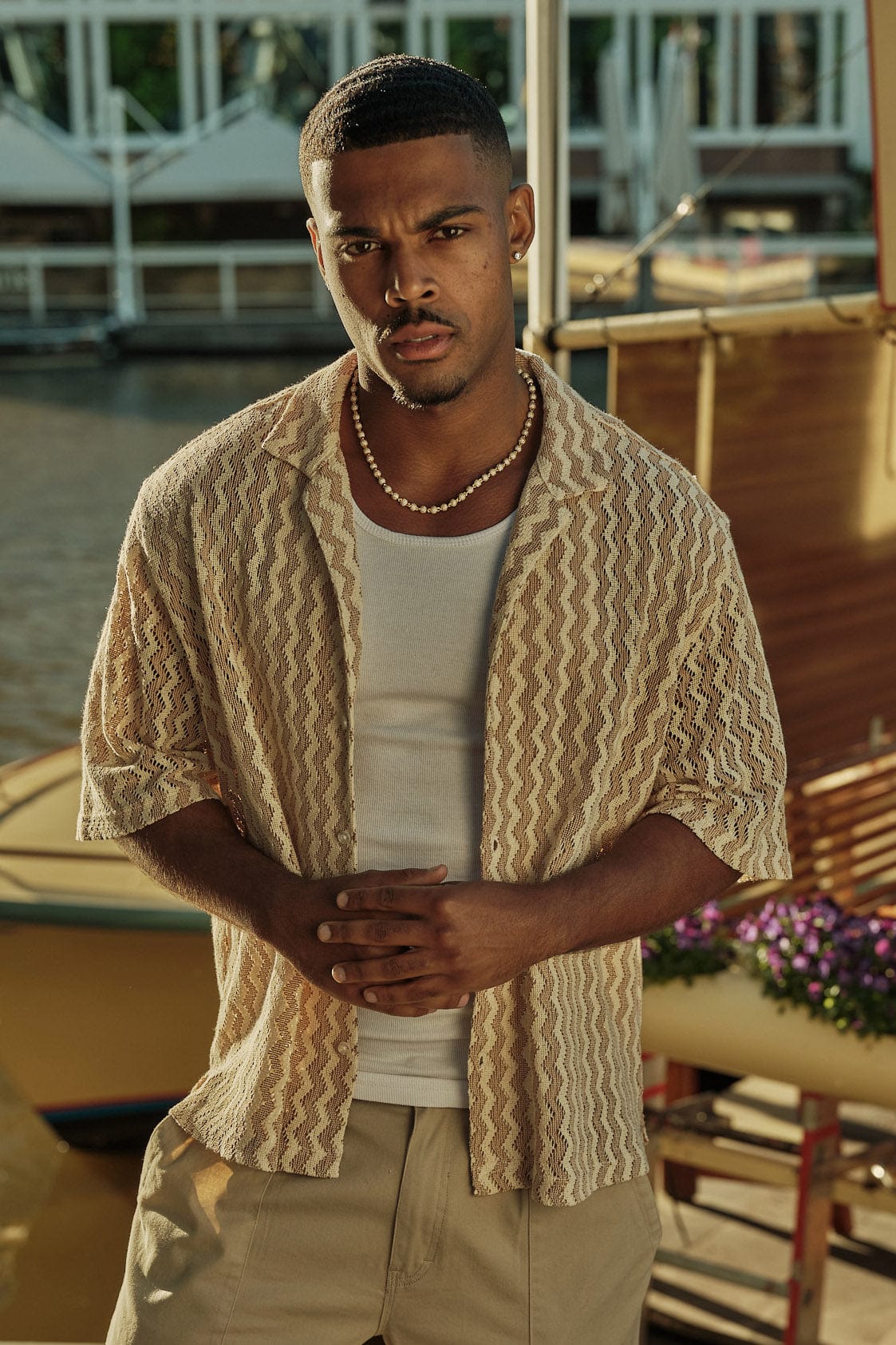 Stylish summer shirt folded on wooden surface