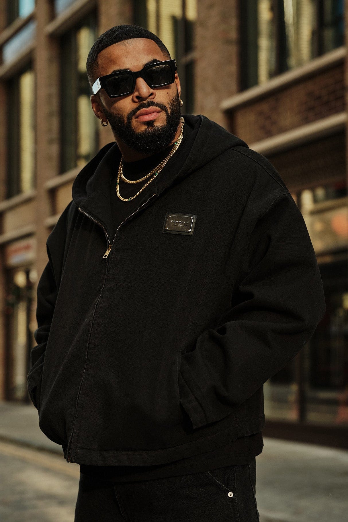 Model wearing the bomber jacket with a neutral background, showcasing fit