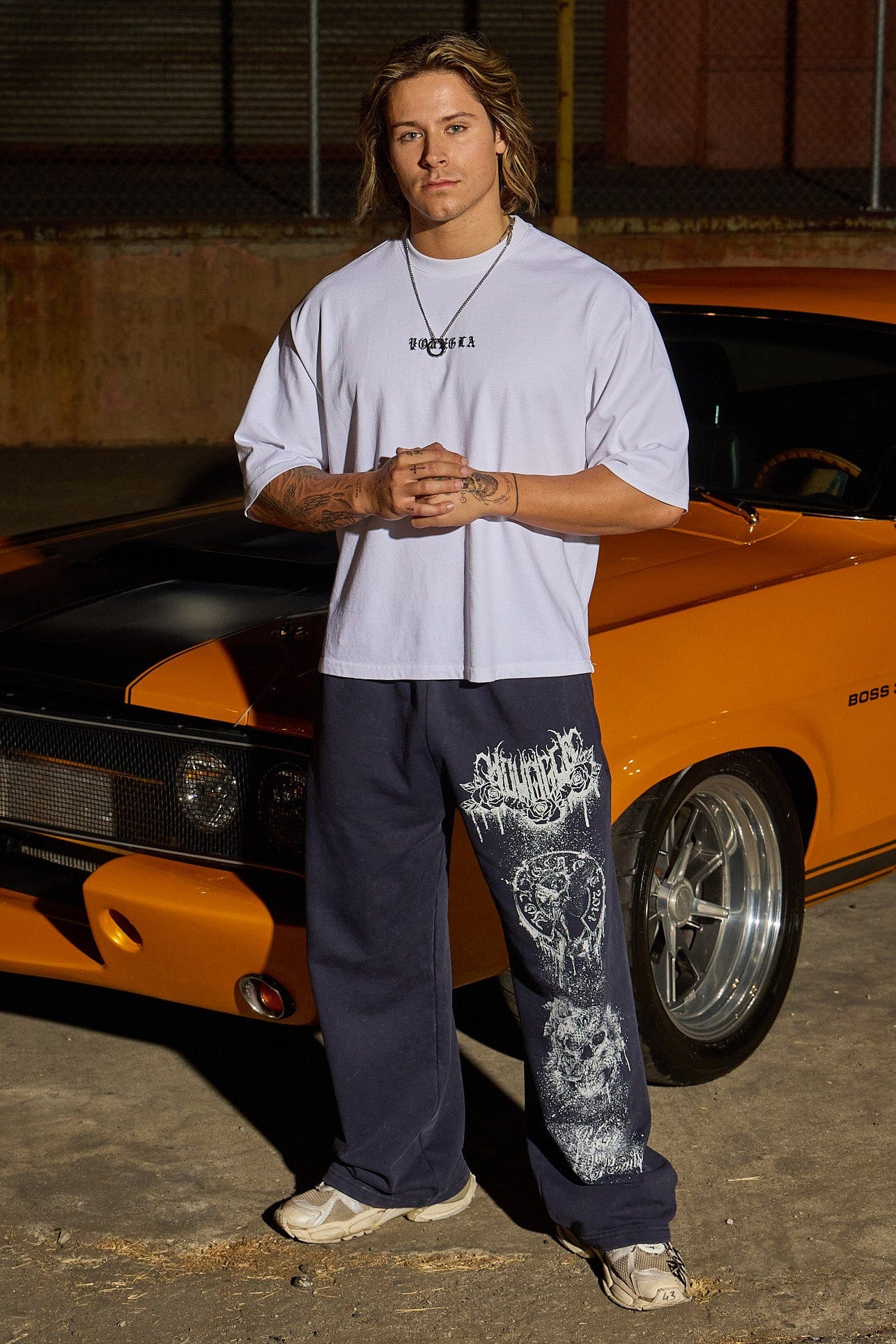 Front view of a model in Dynasty baggy joggers with splatter print.