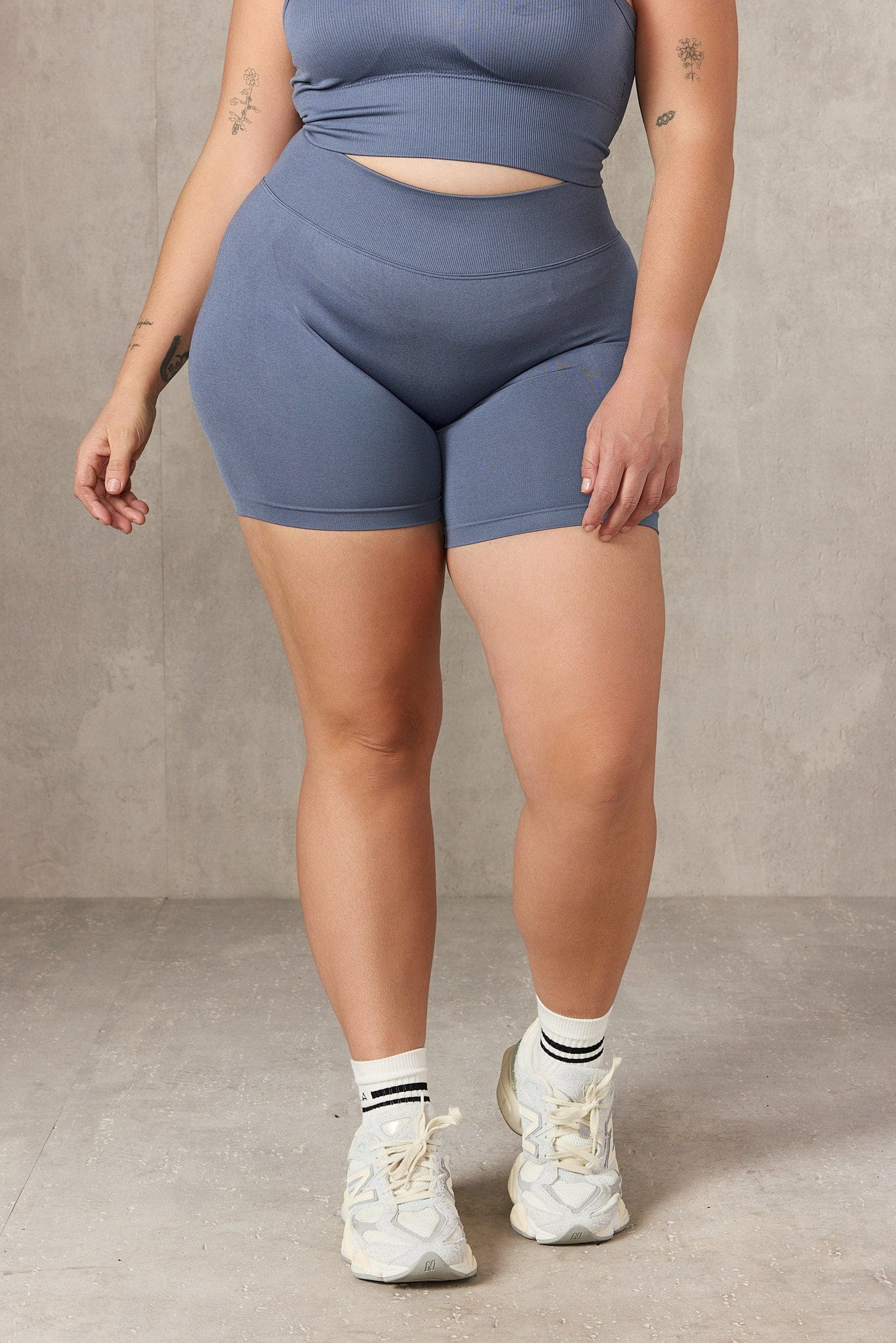 Back detail showing V-cut design of workout shorts with pockets