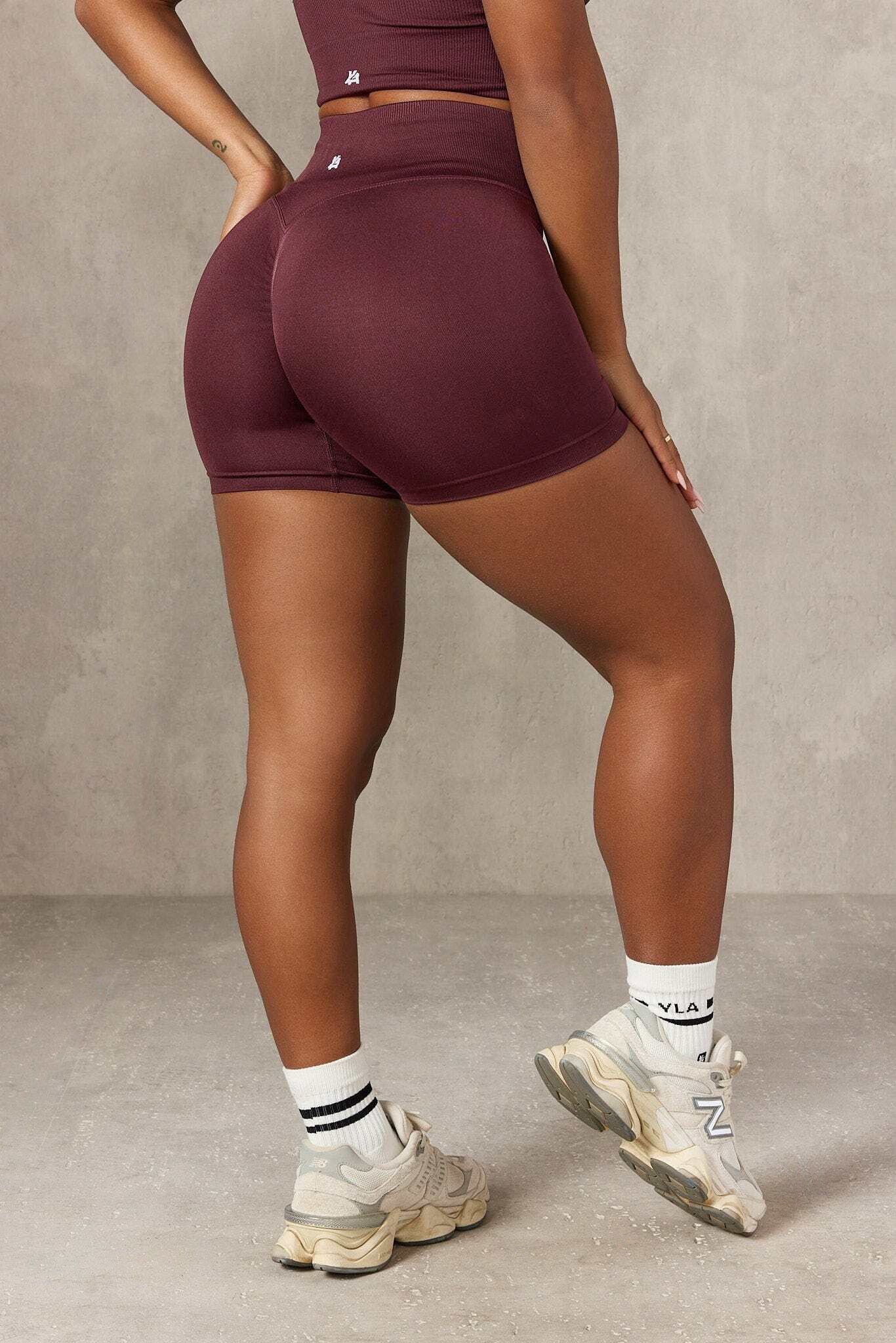 Side view of high waisted gym shorts during yoga pose