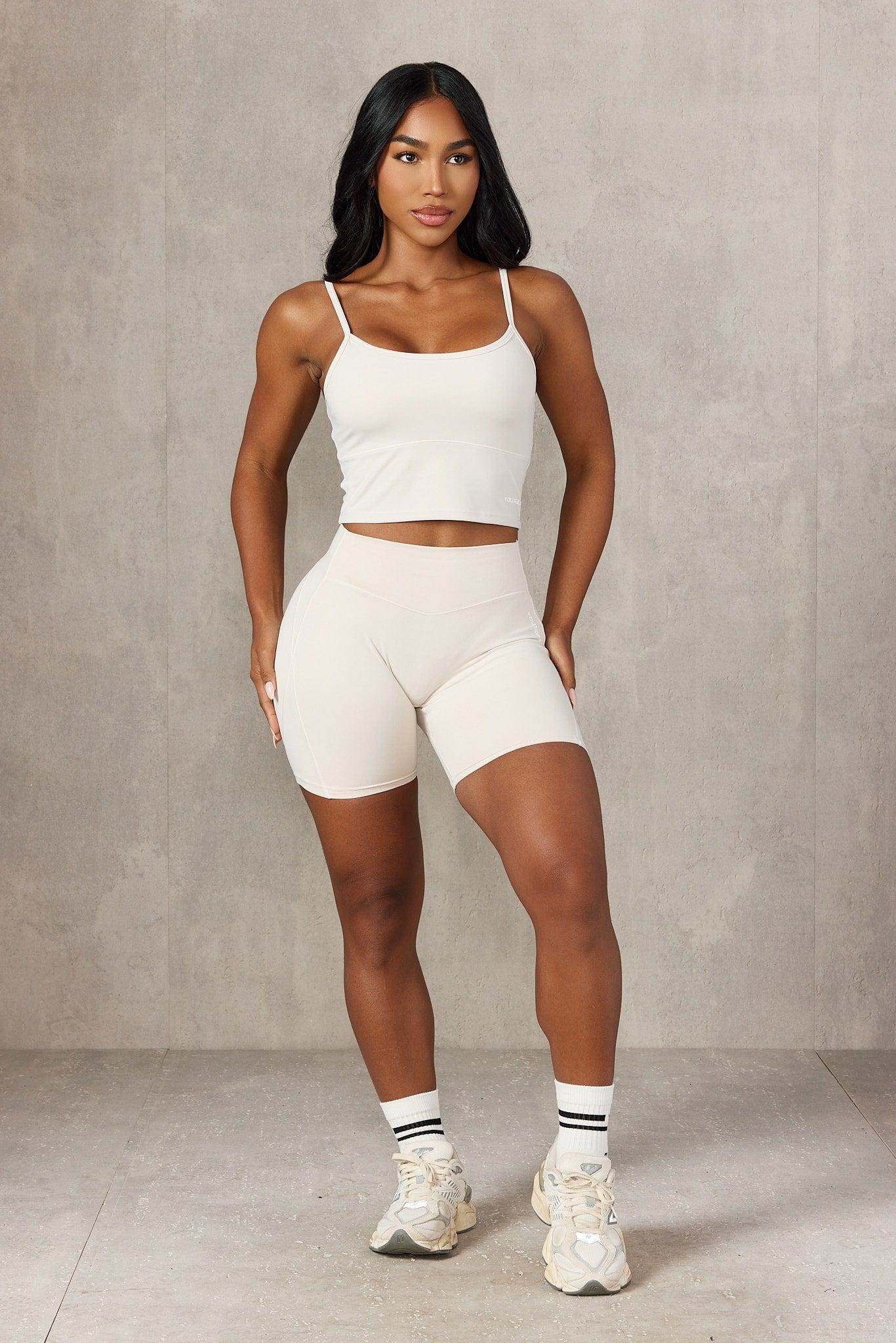 Close-up of adjustable straps on the ladies workout tank, highlighting its features.