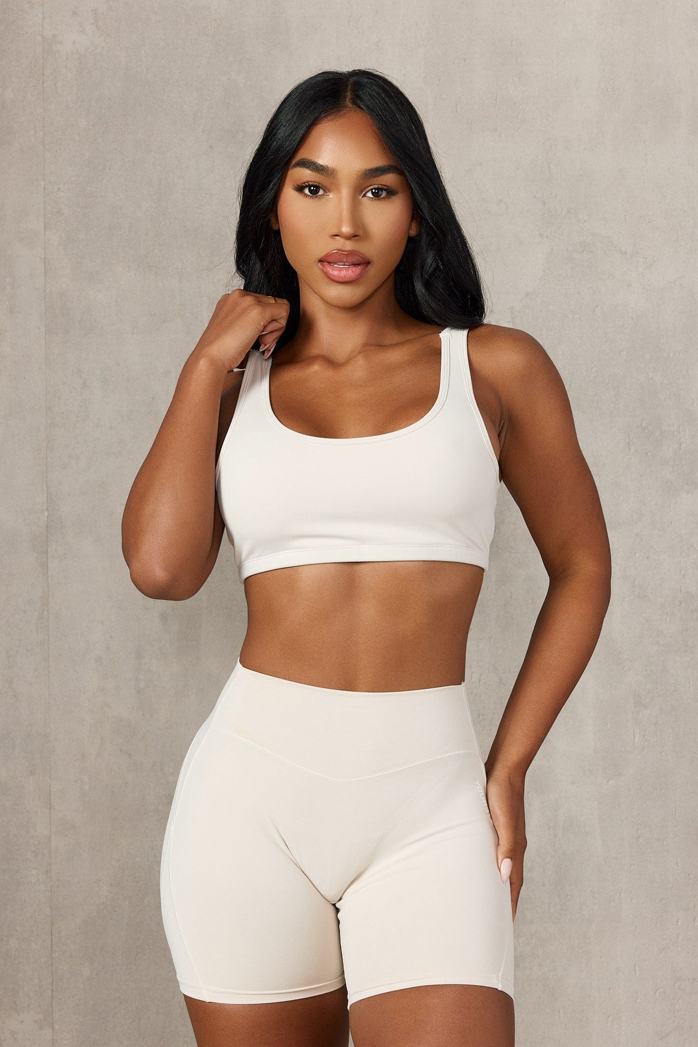 Model wearing the high support sports bra during a workout in the gym