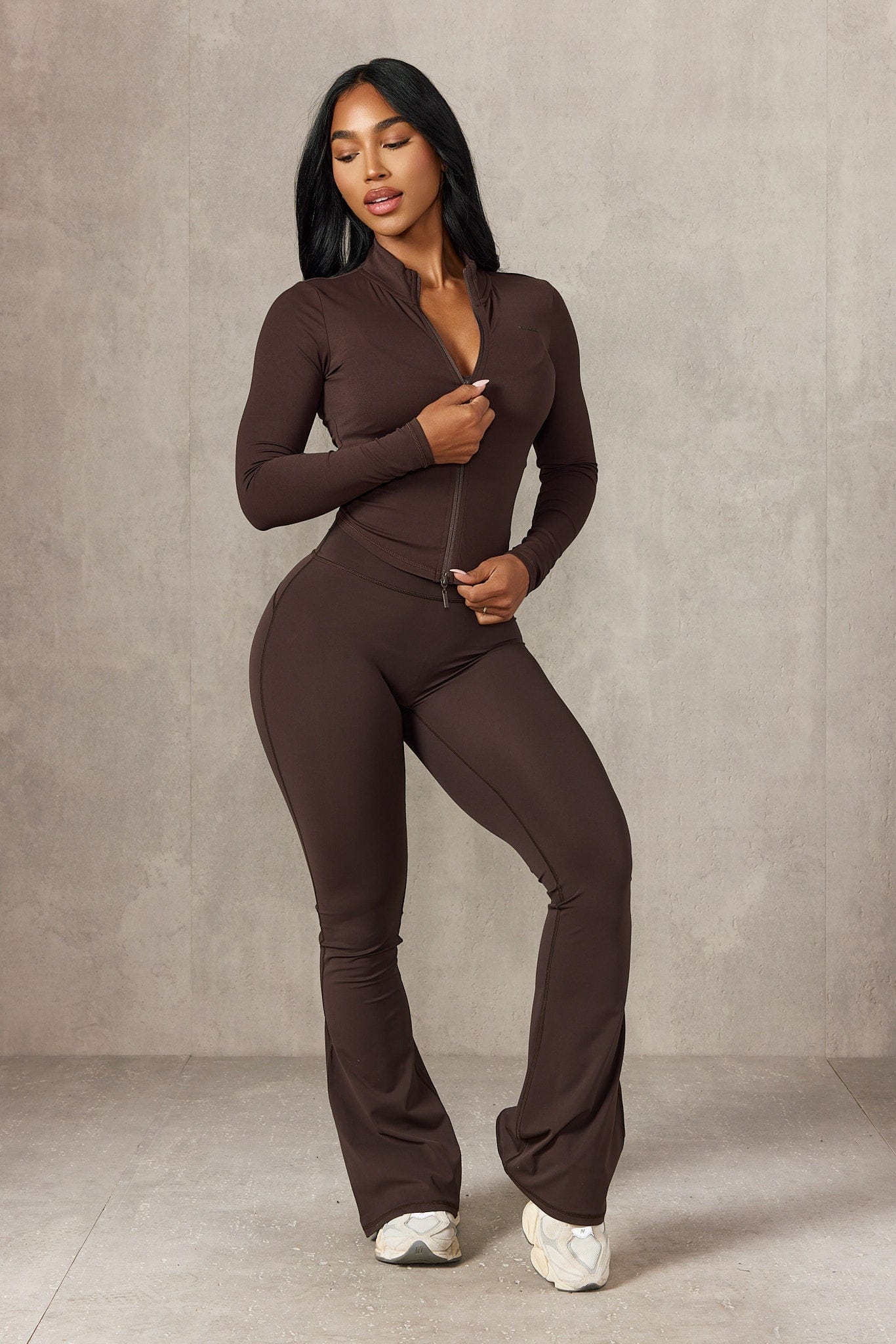 Front-facing view of gym jacket showing double zipper and contour fit