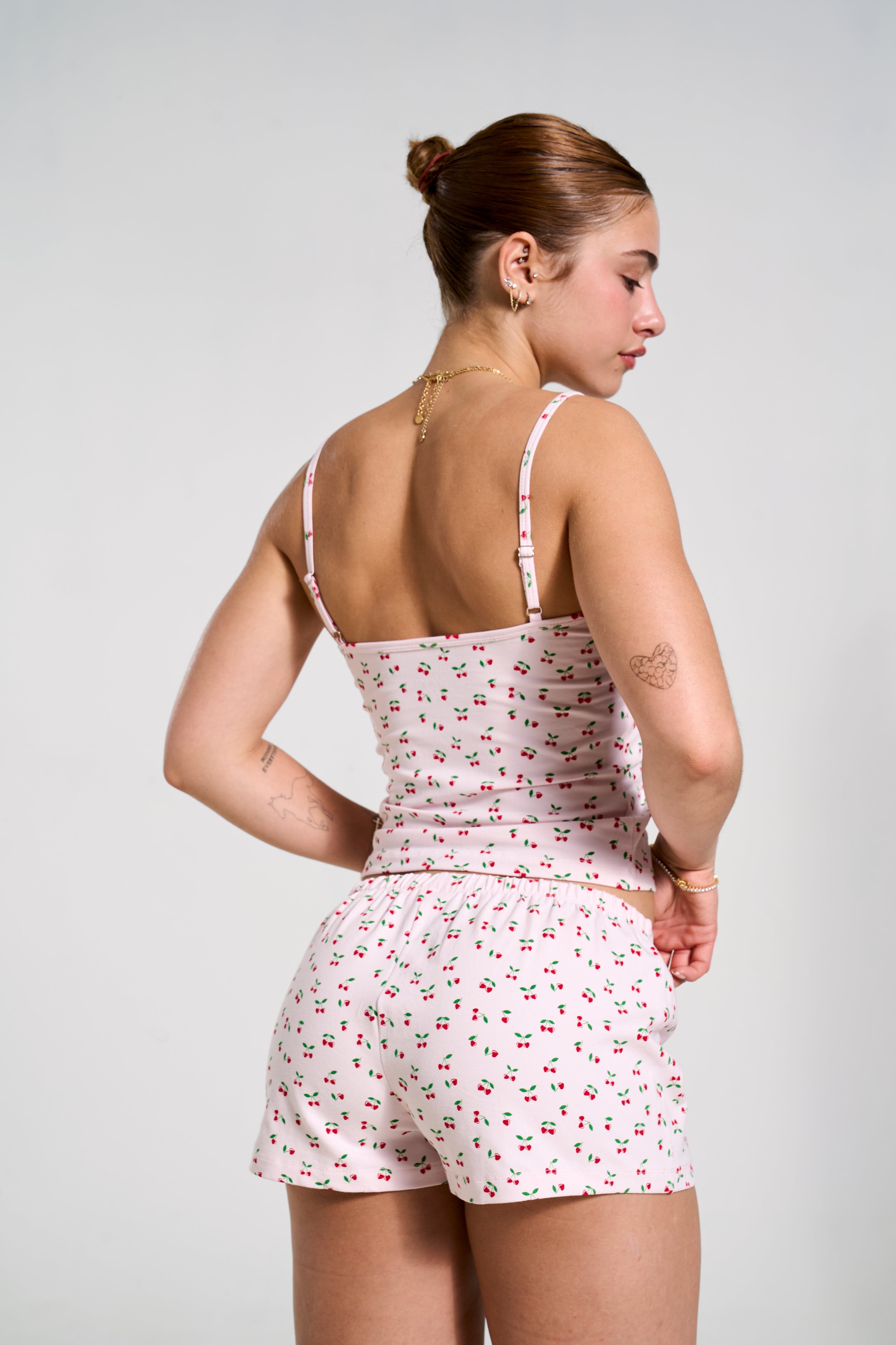 Close-up of lace neckline on cotton PJ top, showcasing elegant design.