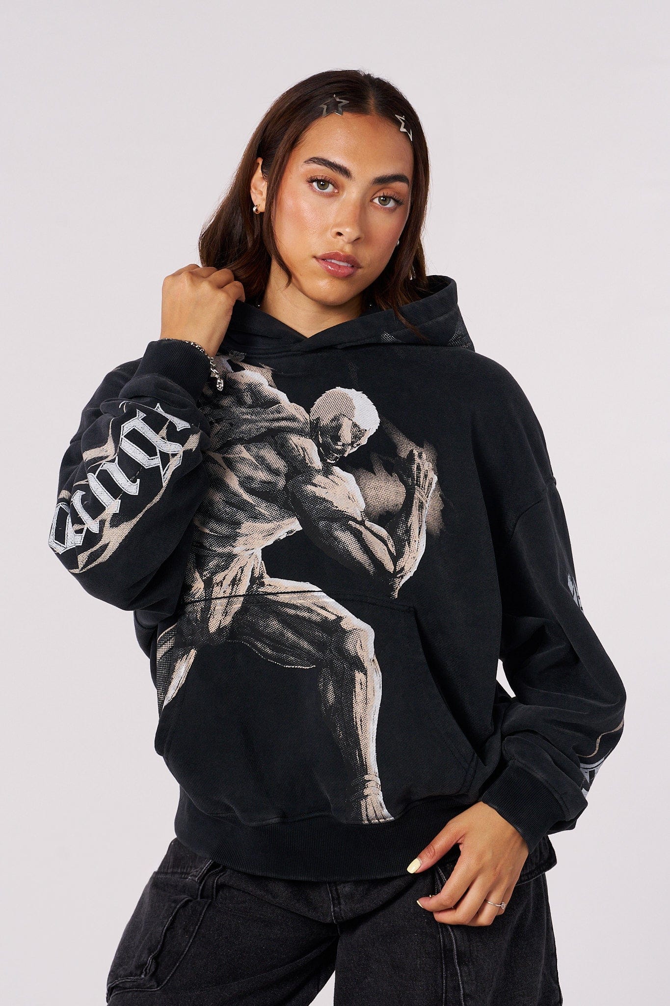 Model wearing the AOT pullover hoodie, showcasing relaxed fit.