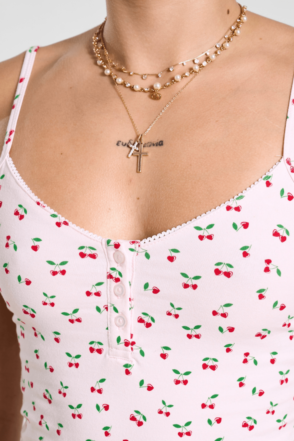 Close-up of lace neckline on cotton PJ top, showcasing elegant design.