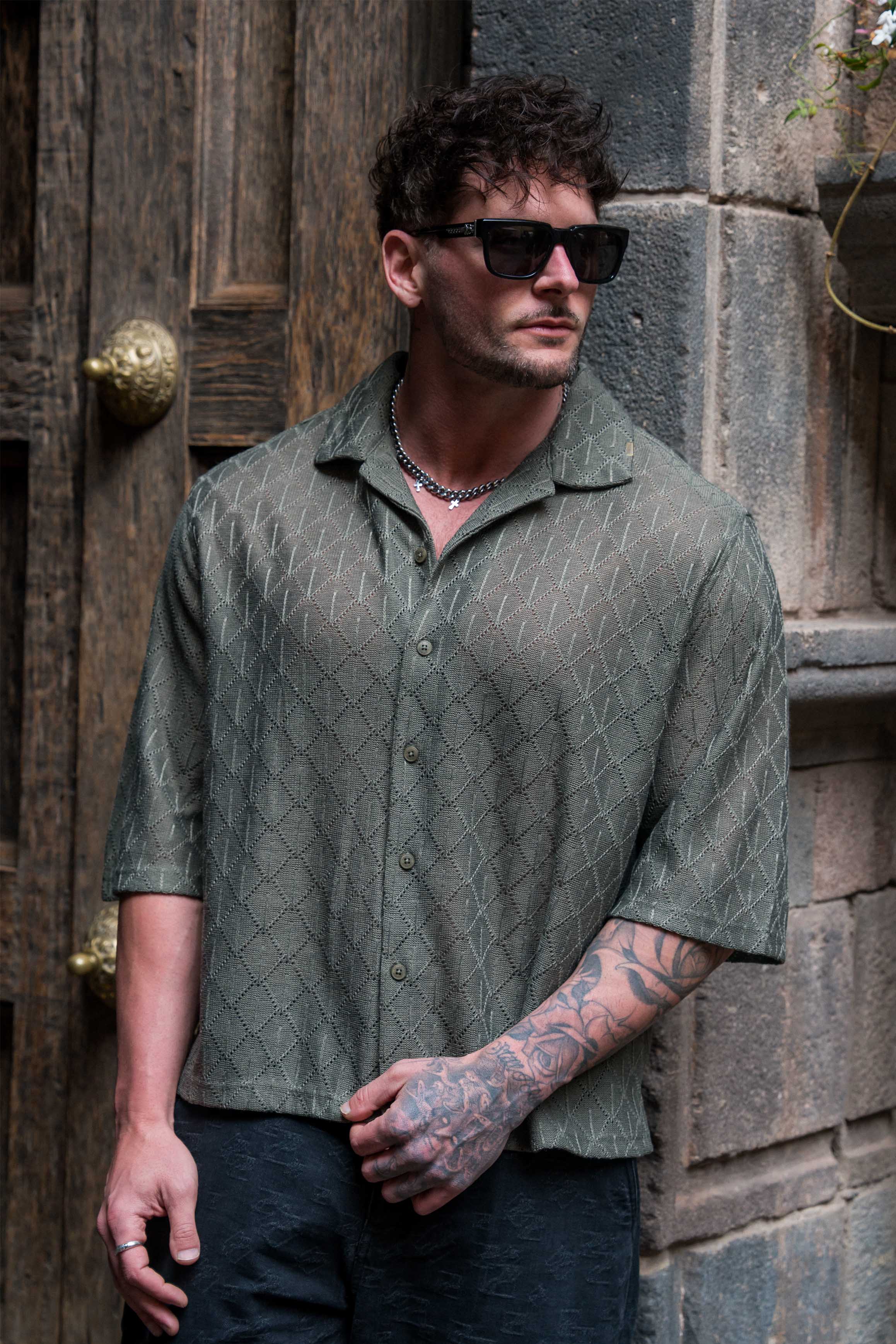 Front view of the crochet button-up shirt, ideal for summer parties.