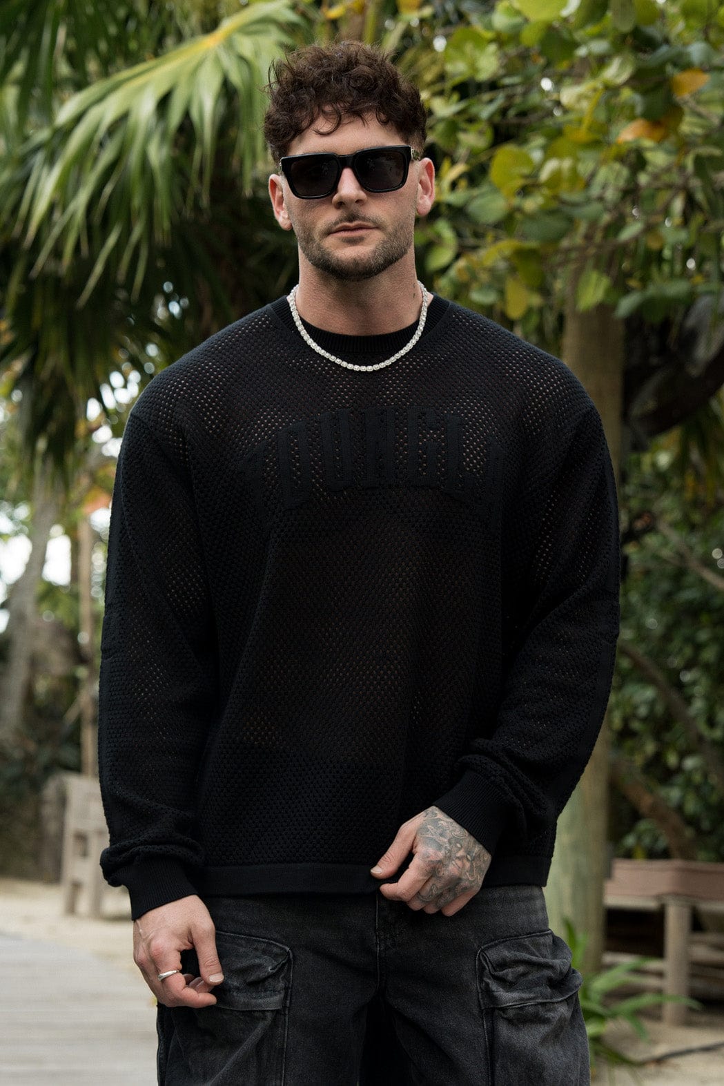 Model wearing YoungLA 99 Knit Long Sleeve T-Shirt in a relaxed setting.