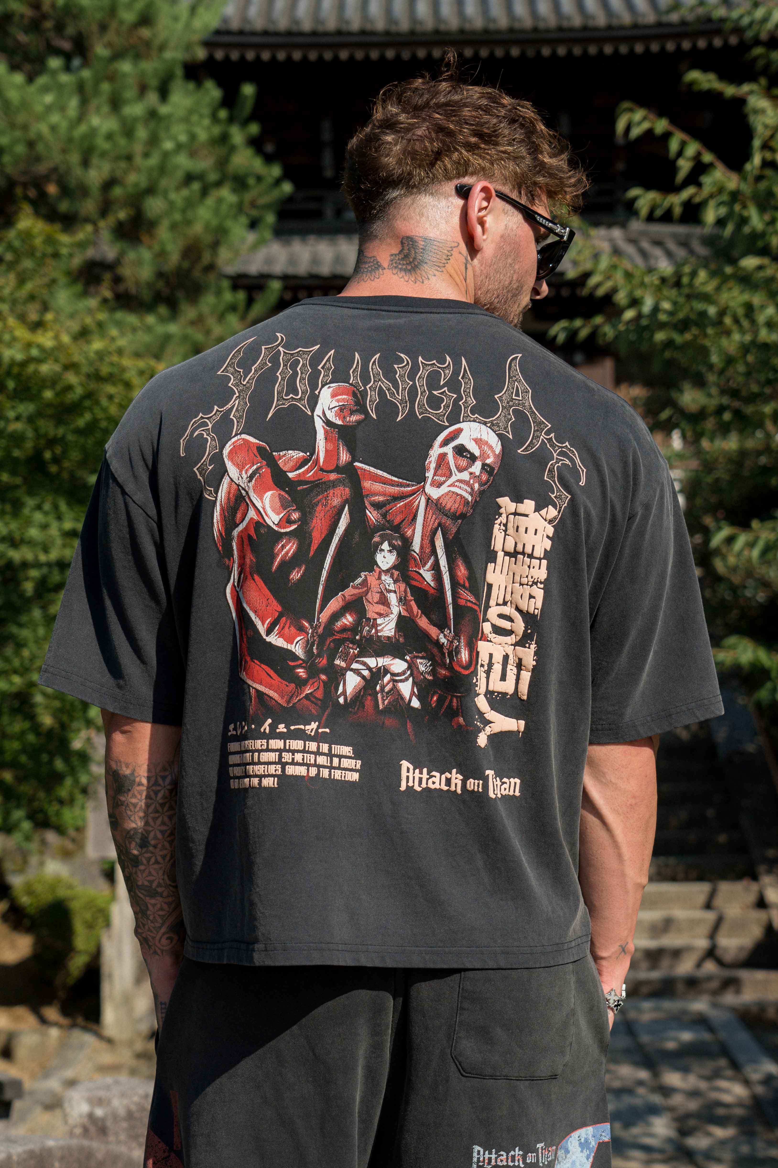 Close-up of the detailed design on the Attack on Titan cropped tee.