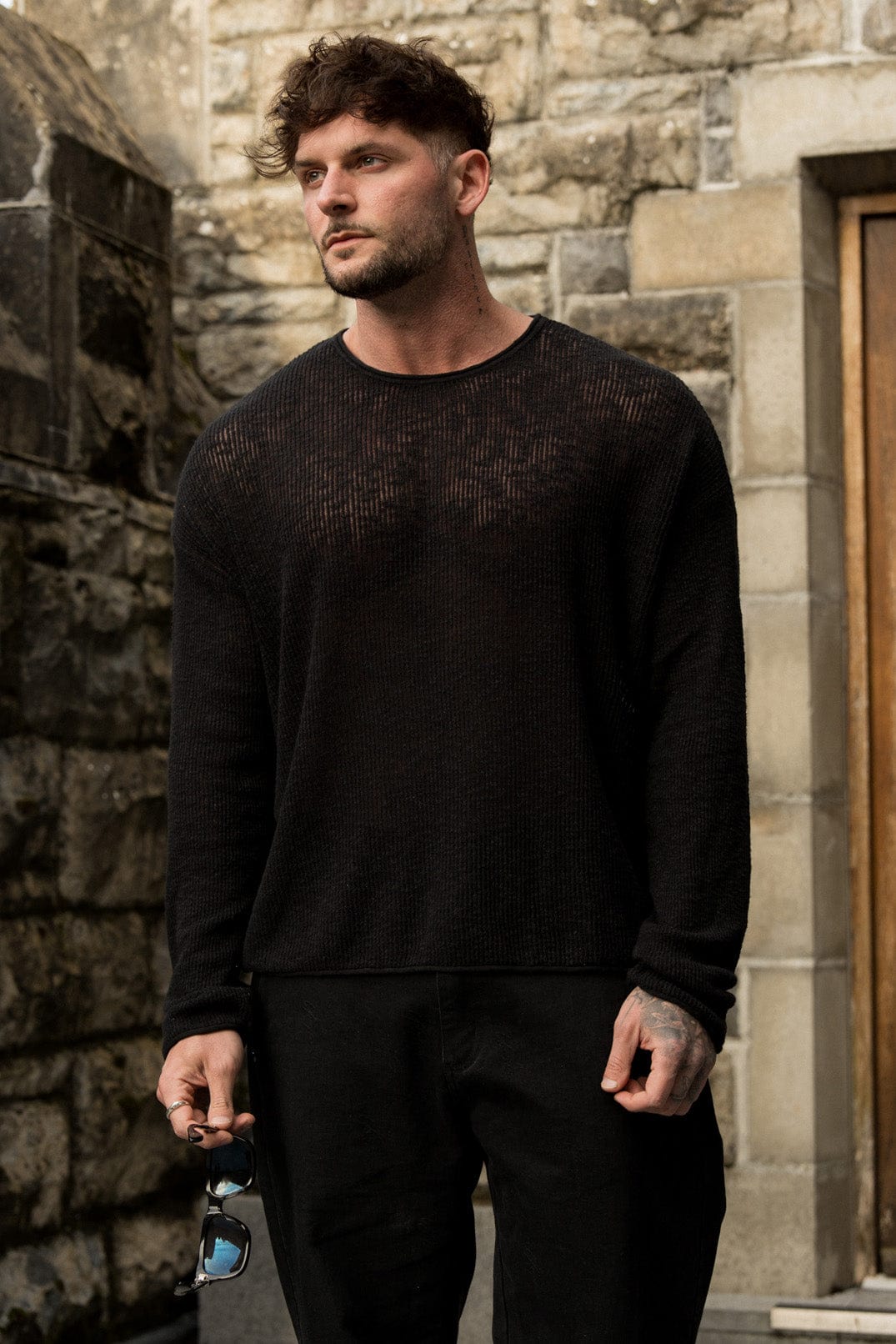 Close-up of the crochet knit texture on the long sleeve crop shirt.