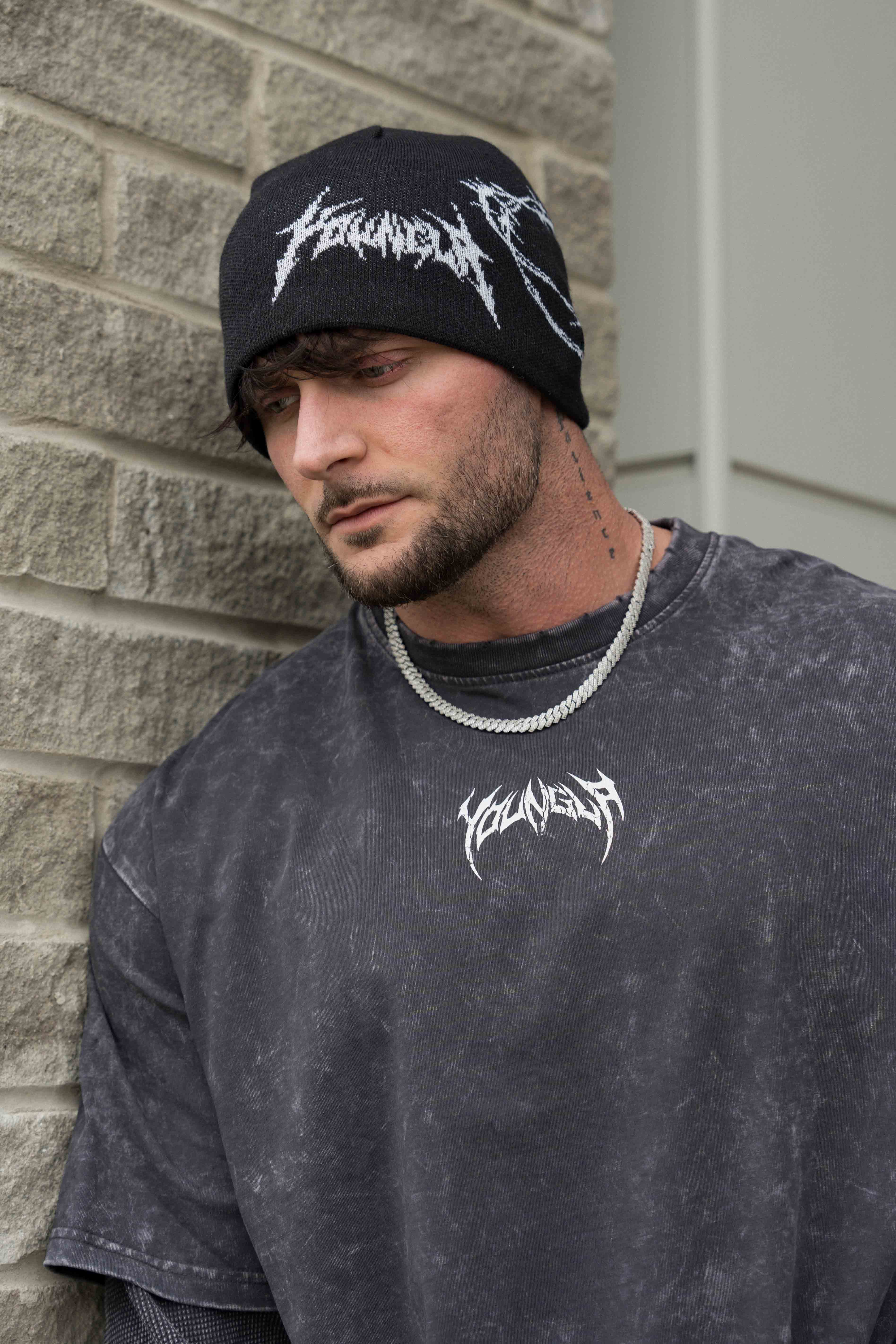 Front view of the wool blend beanie with barbed wire crochet pattern on city streets