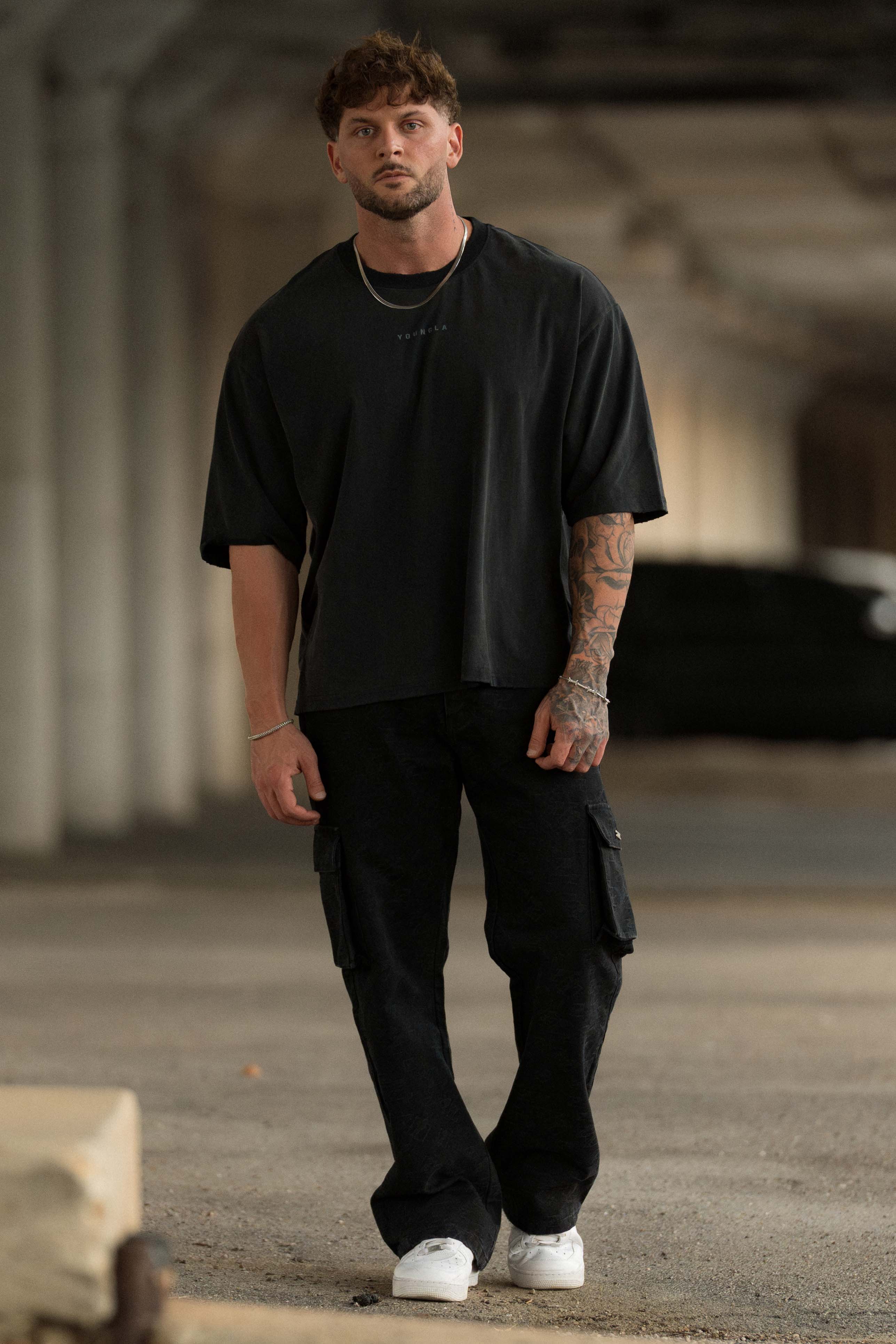 Front view of Chaos oversized graphic tee showcasing tattoo-inspired design.