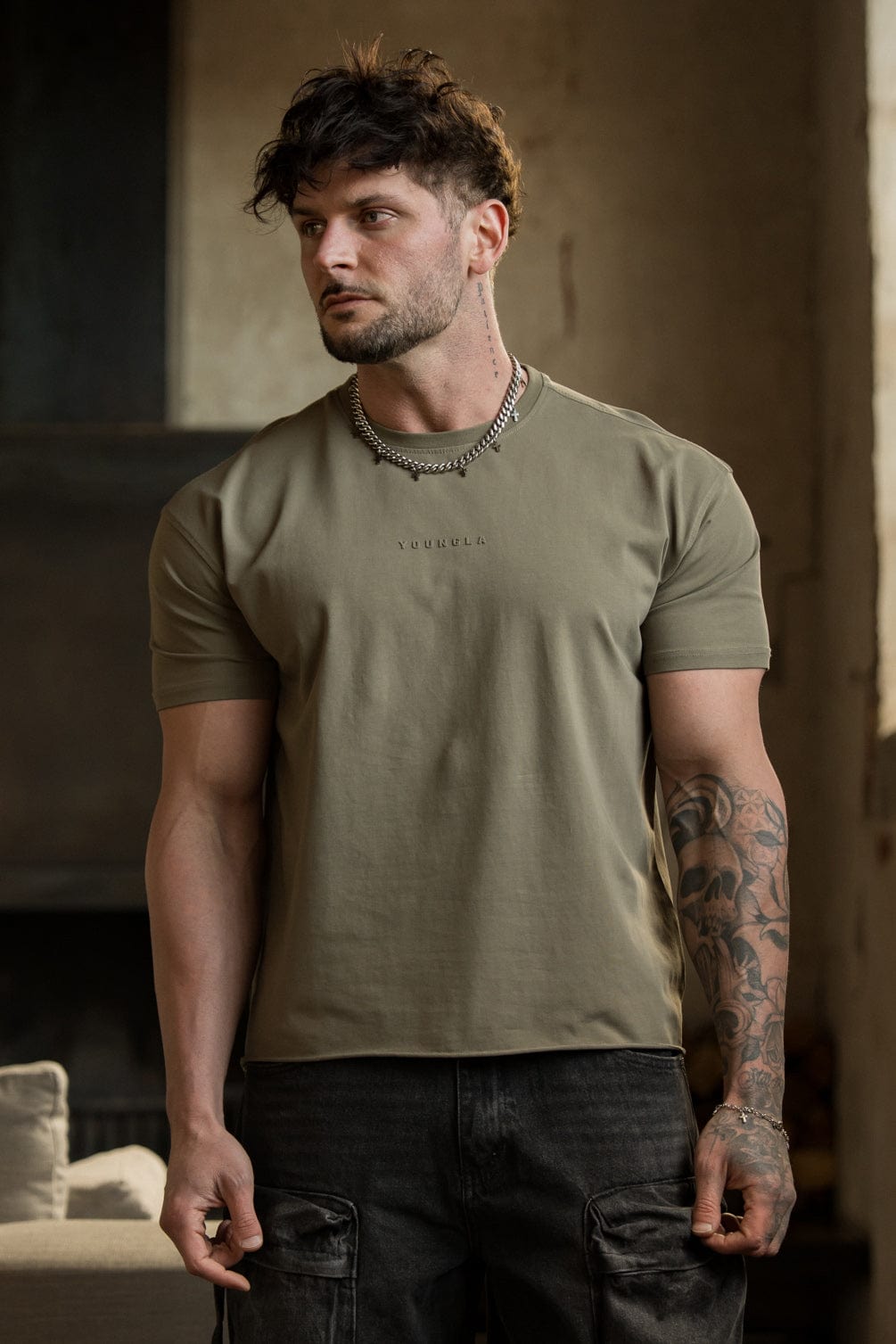 Front view of the oversized cropped tee on a model in a casual setting.
