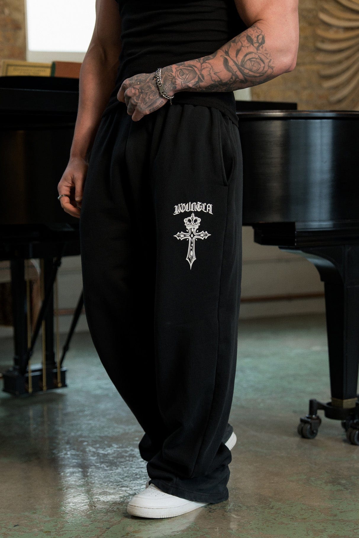 Model wearing Faith Sweats in a streetwear setting