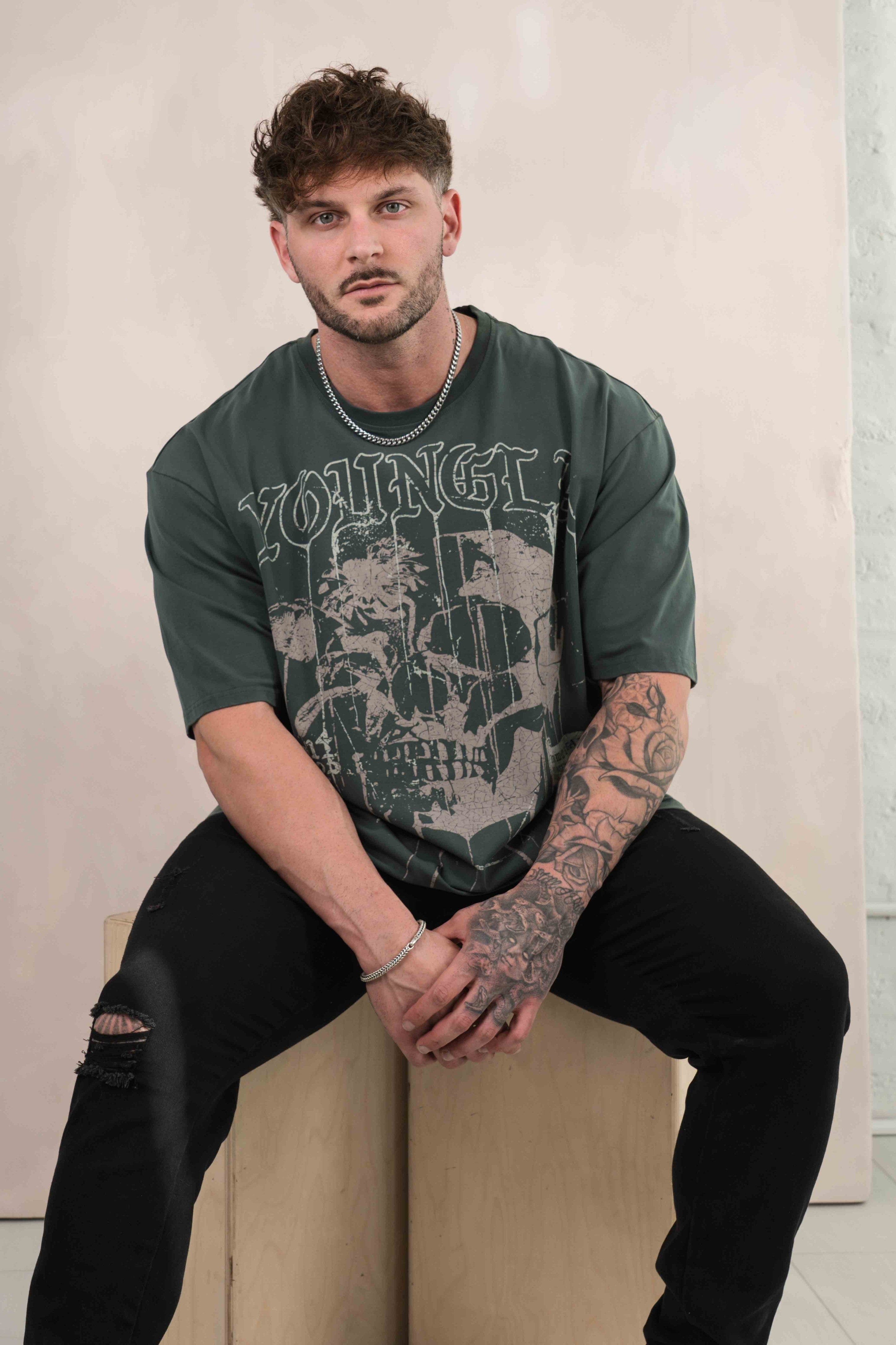 Front view of the floral skull graphic tee in casual setting.