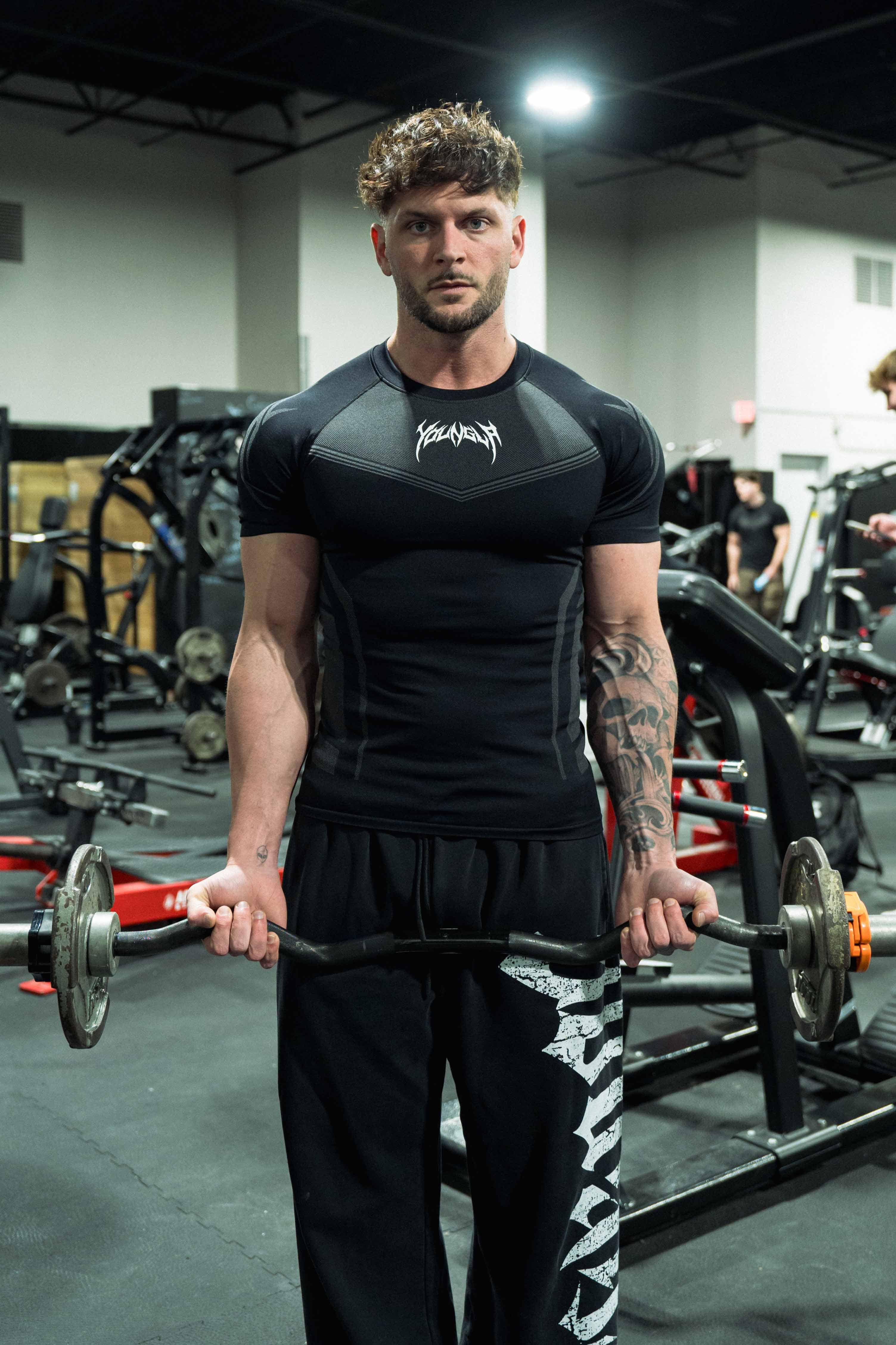 Compression shirt men prefer for gym or streetwear—photographed mid-stride