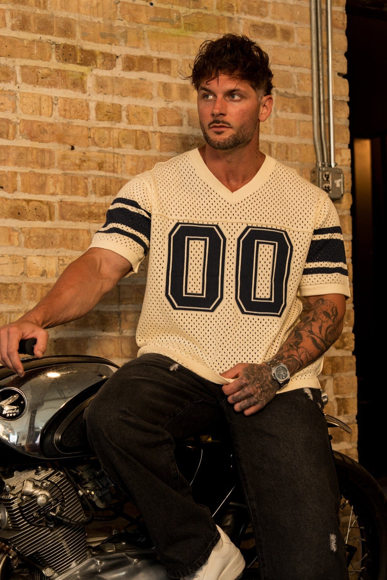 Front view of varsity knit jersey with stripes and varsity number
