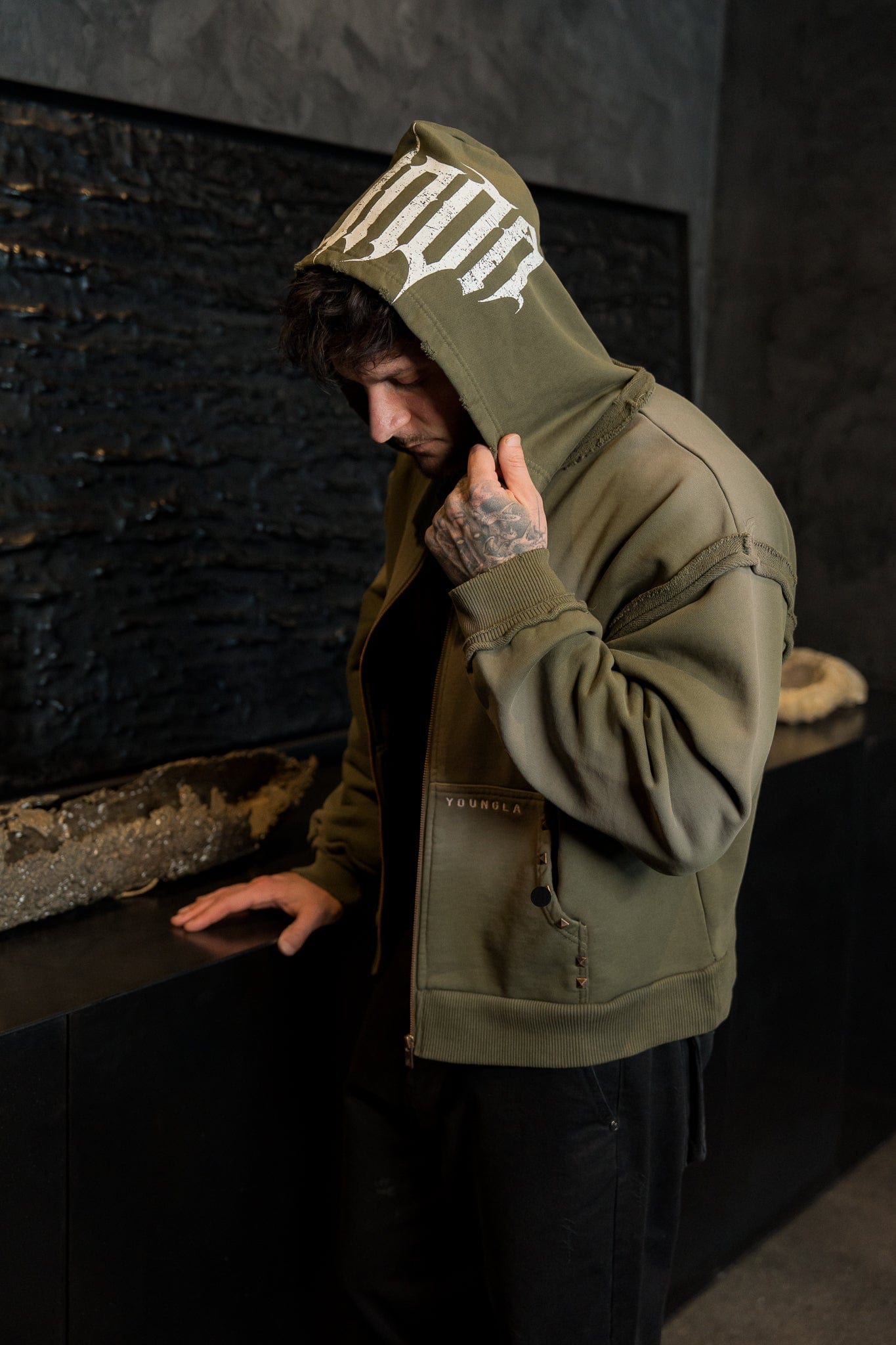 Front view of the vintage-washed, heavy French Terry hoodie in streetwear style