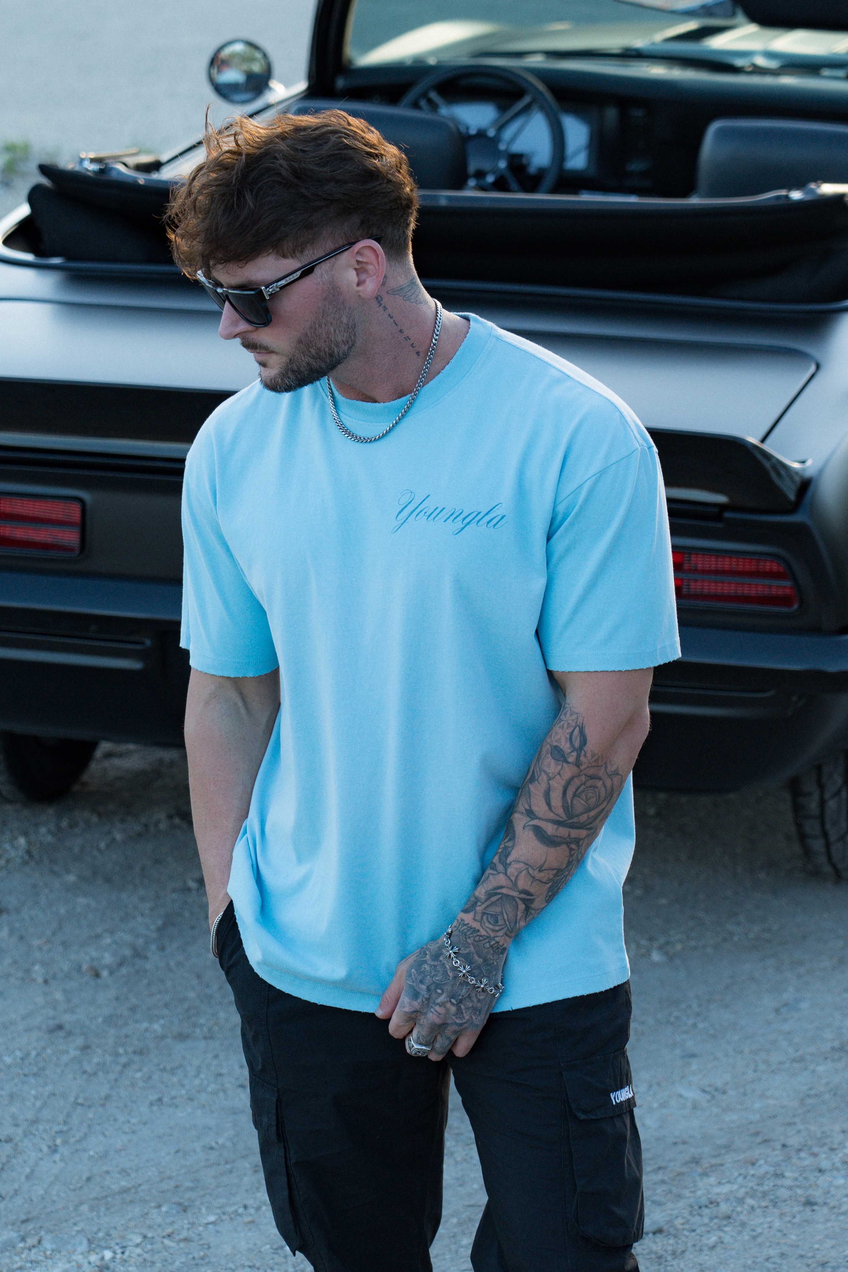 Model showcasing the Spartan tee, highlighting its comfortable fit.
