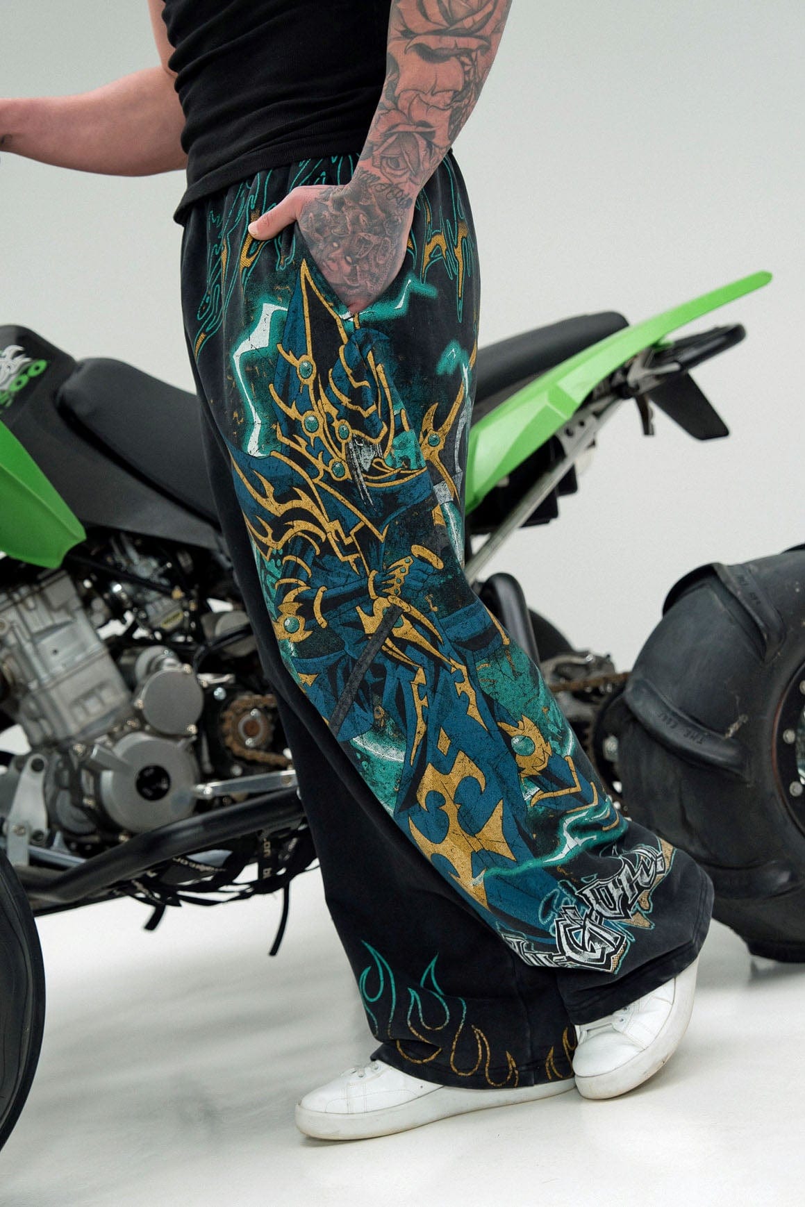 Side angle showcasing the oversized character graphic on the sweatpants