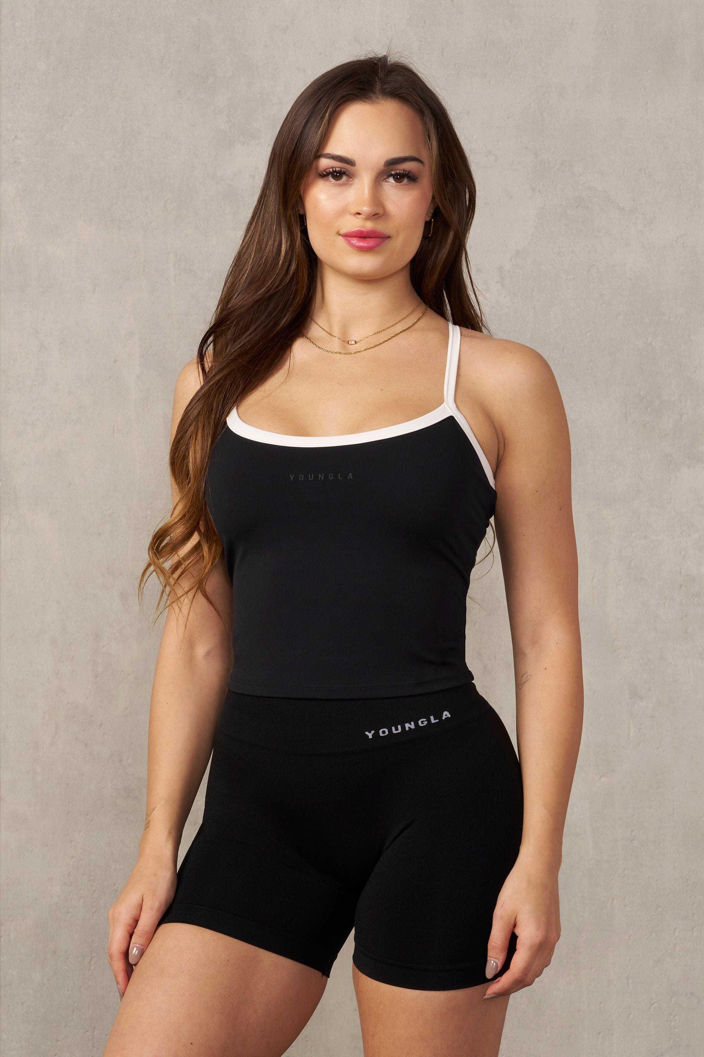 Side view of the Core Edge Active Tank showcasing its stretchy fabric and fit.