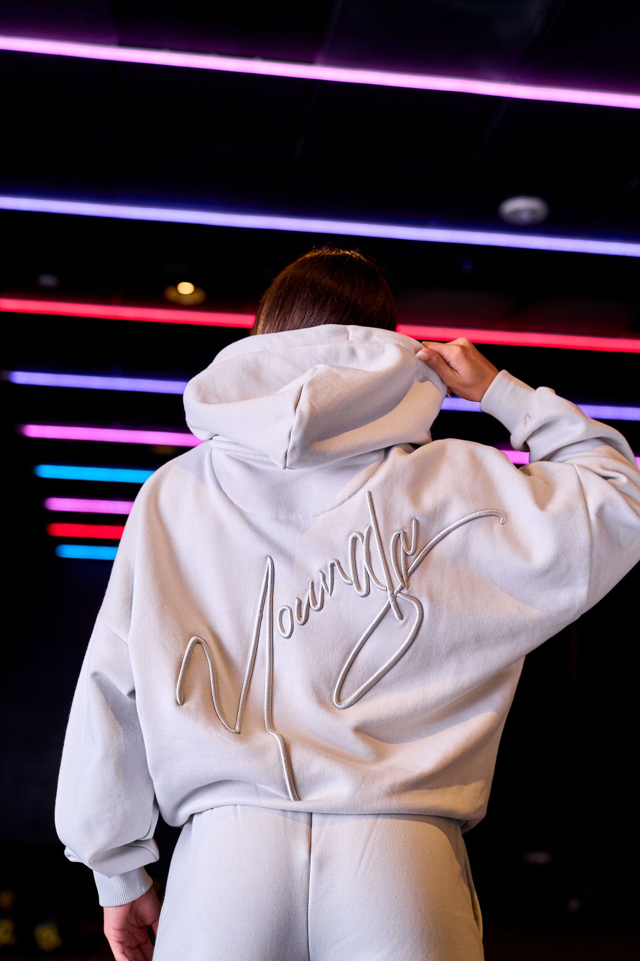 Close-up of the embroidered detail on the oversized hoodie.