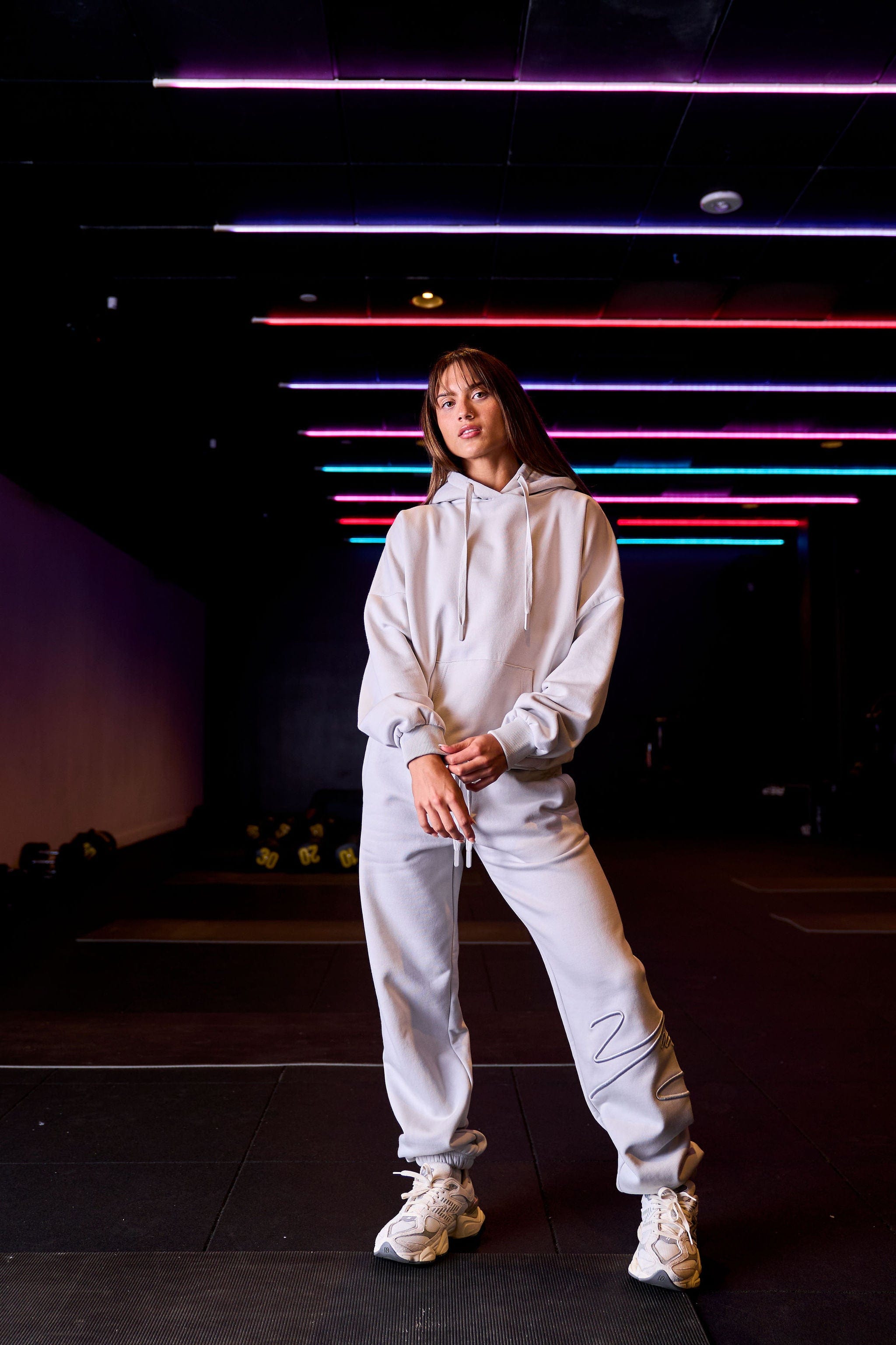 Model wearing the oversized zip up hoodie in a casual setting.
