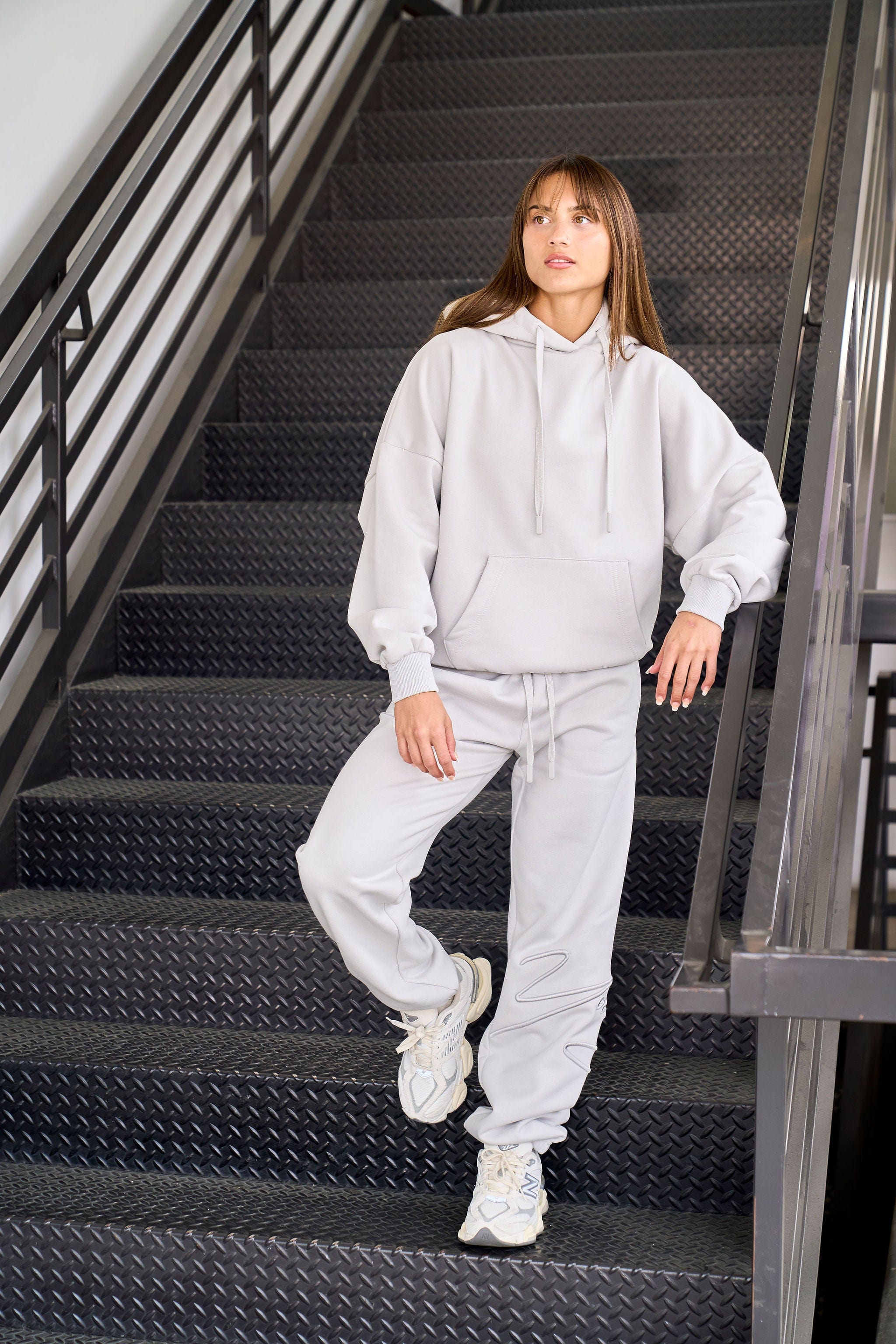 Model in signature joggers showcasing vibrant spring colors.