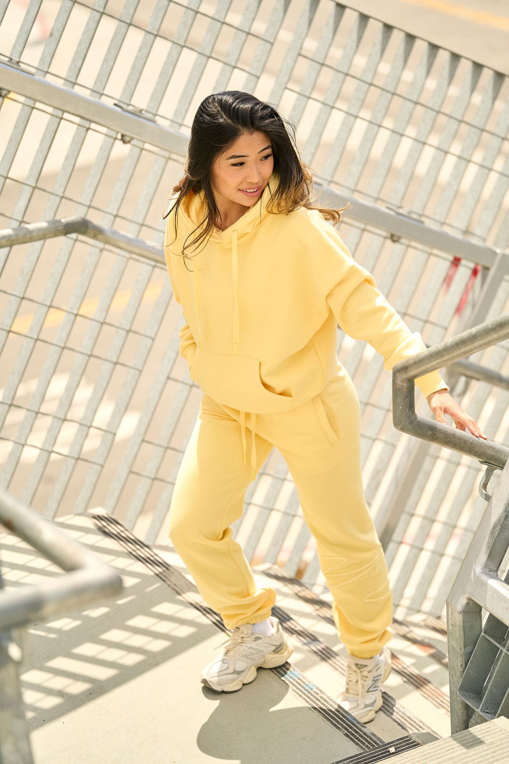 Model wearing the oversized zip up hoodie in a casual setting.