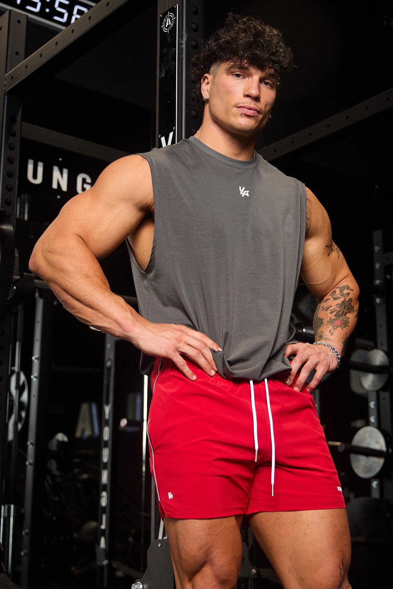 Lifestyle photo of gym shorts styled with workout gear in a city gym