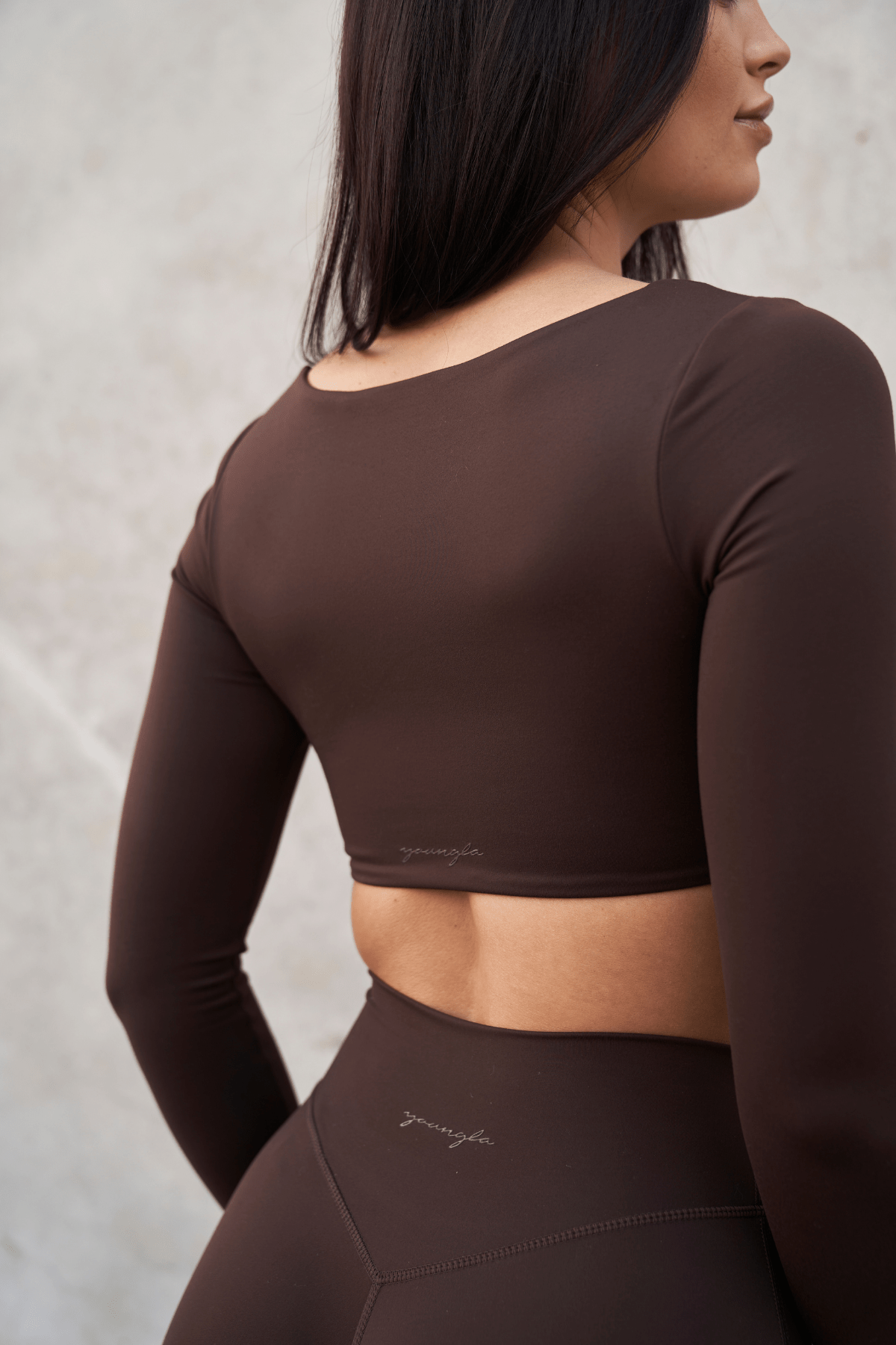 Chic square neck design of the Curve Long Sleeve Sports Bra in action.