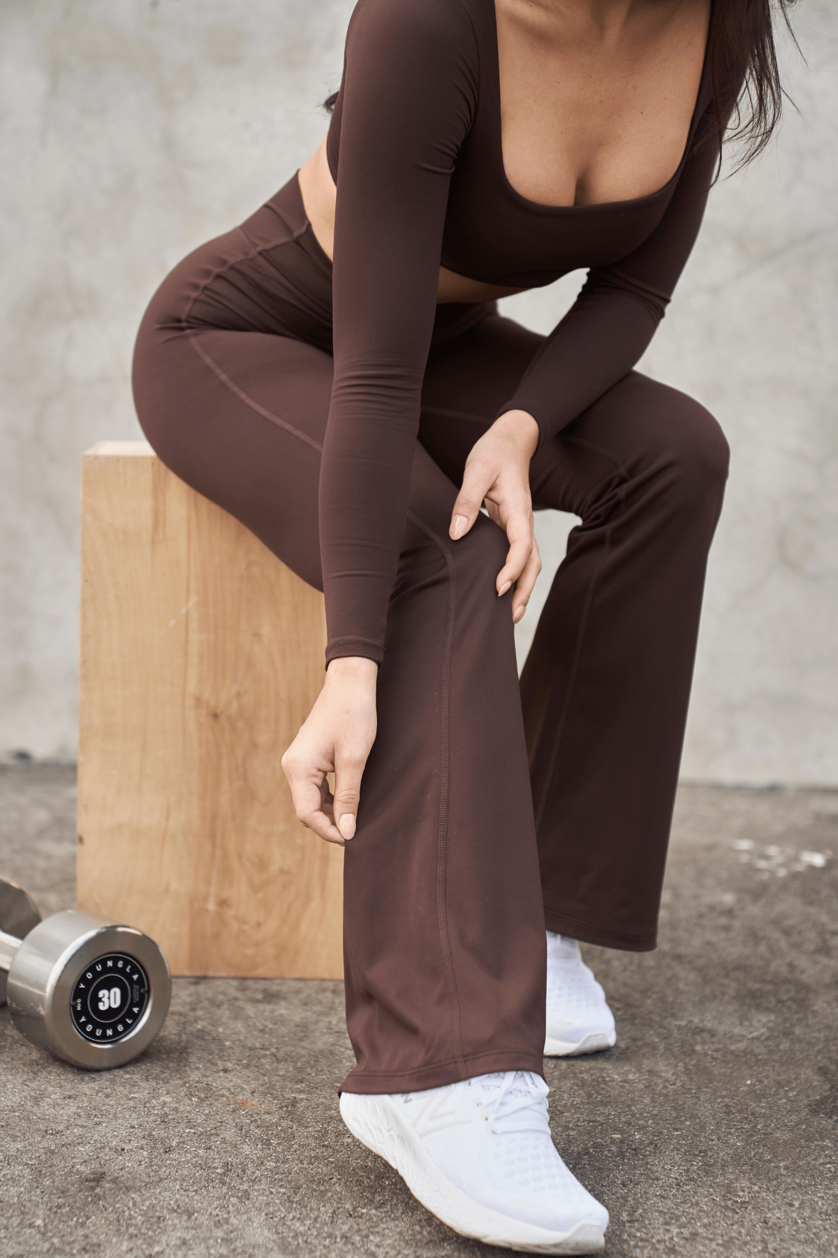 Back view showing curve-enhancing seam of flare leggings