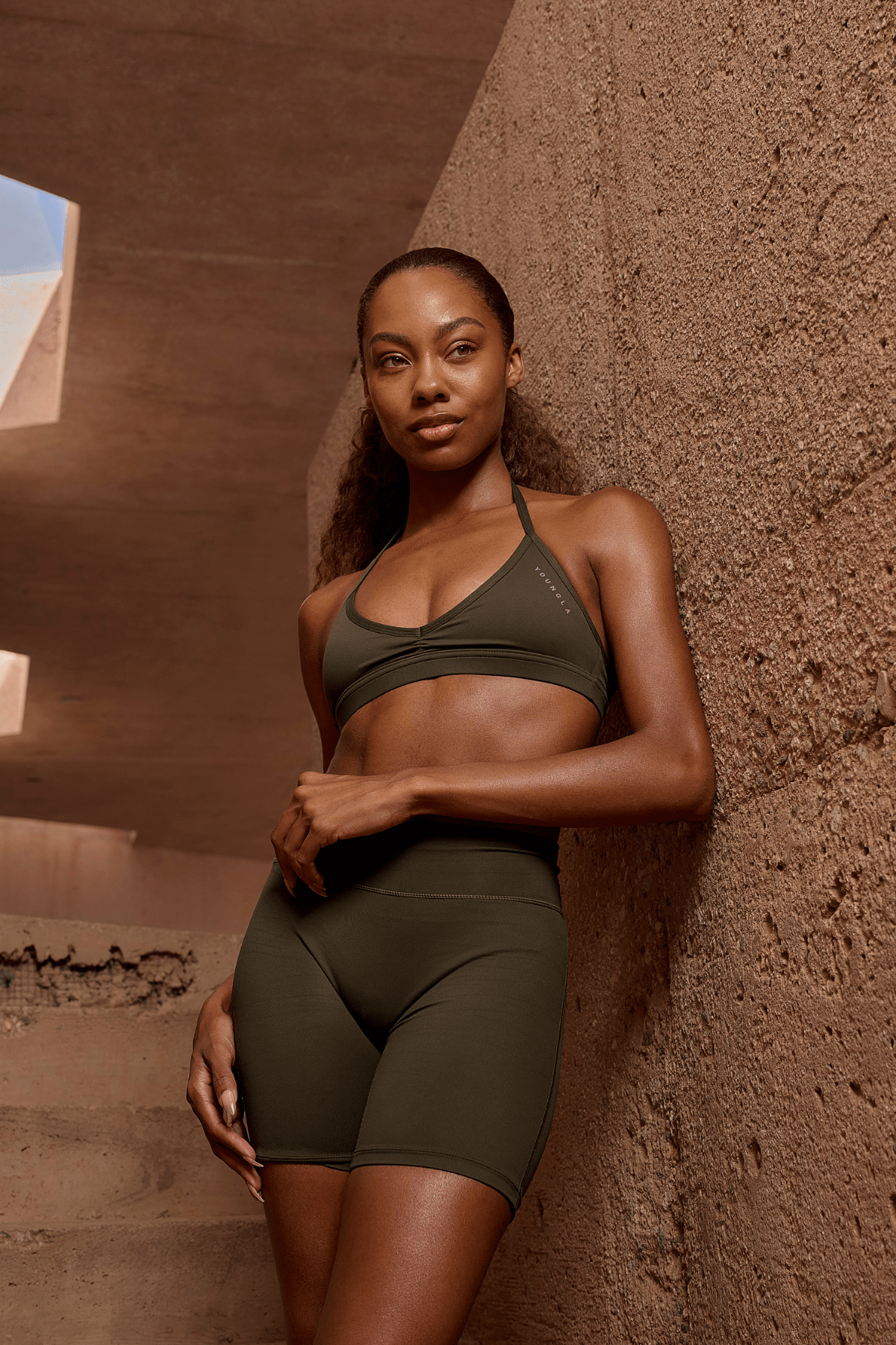 Backless design of the Urban V-Neck workout bra during exercise.