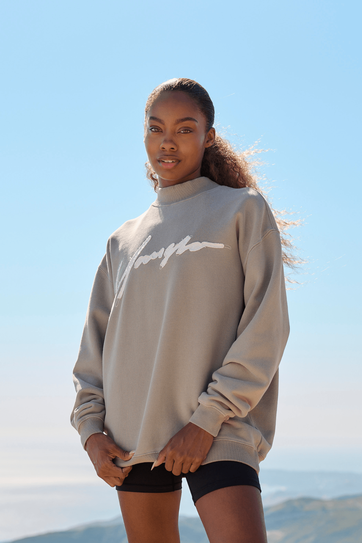 Model wearing the Urban Crewneck in a winter street style setting, showcasing its relaxed fit