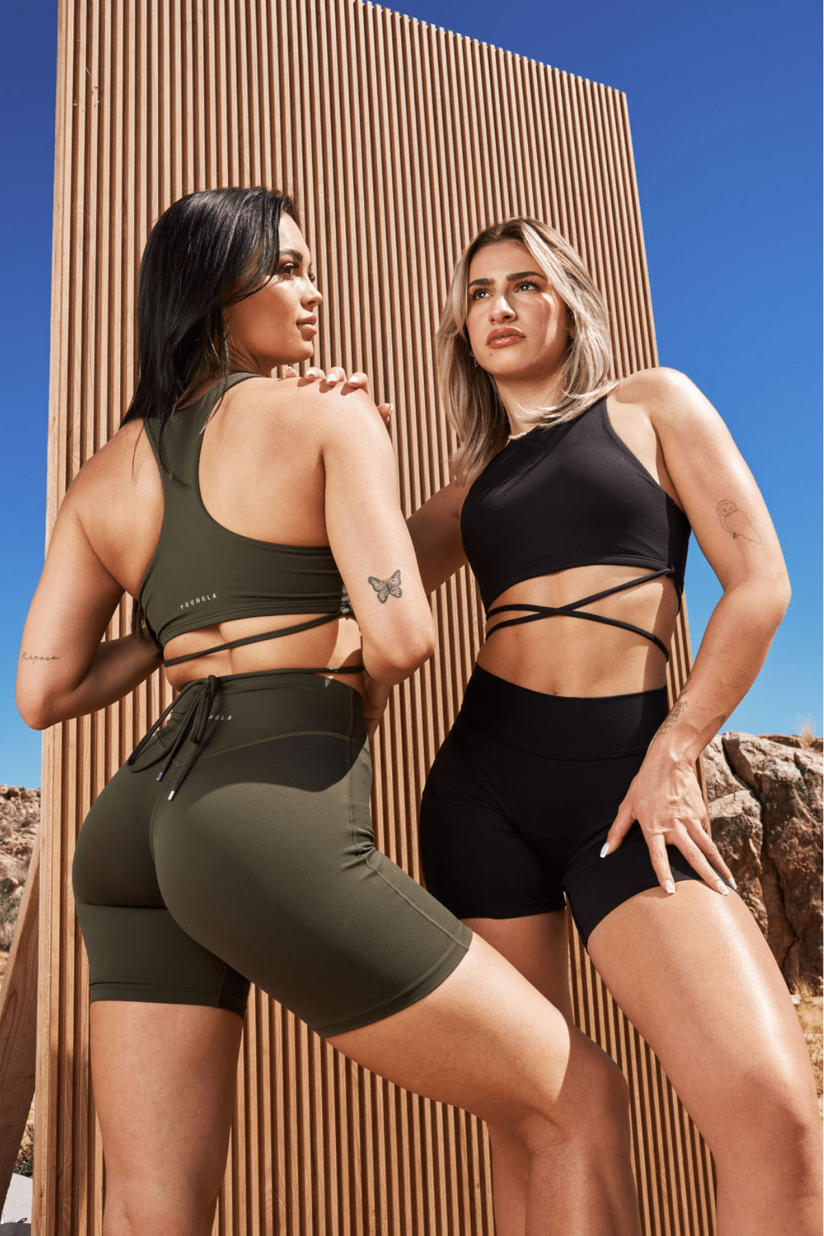 Woman wearing Urban Wrap Sports Bra during yoga pose, showcasing flexibility.