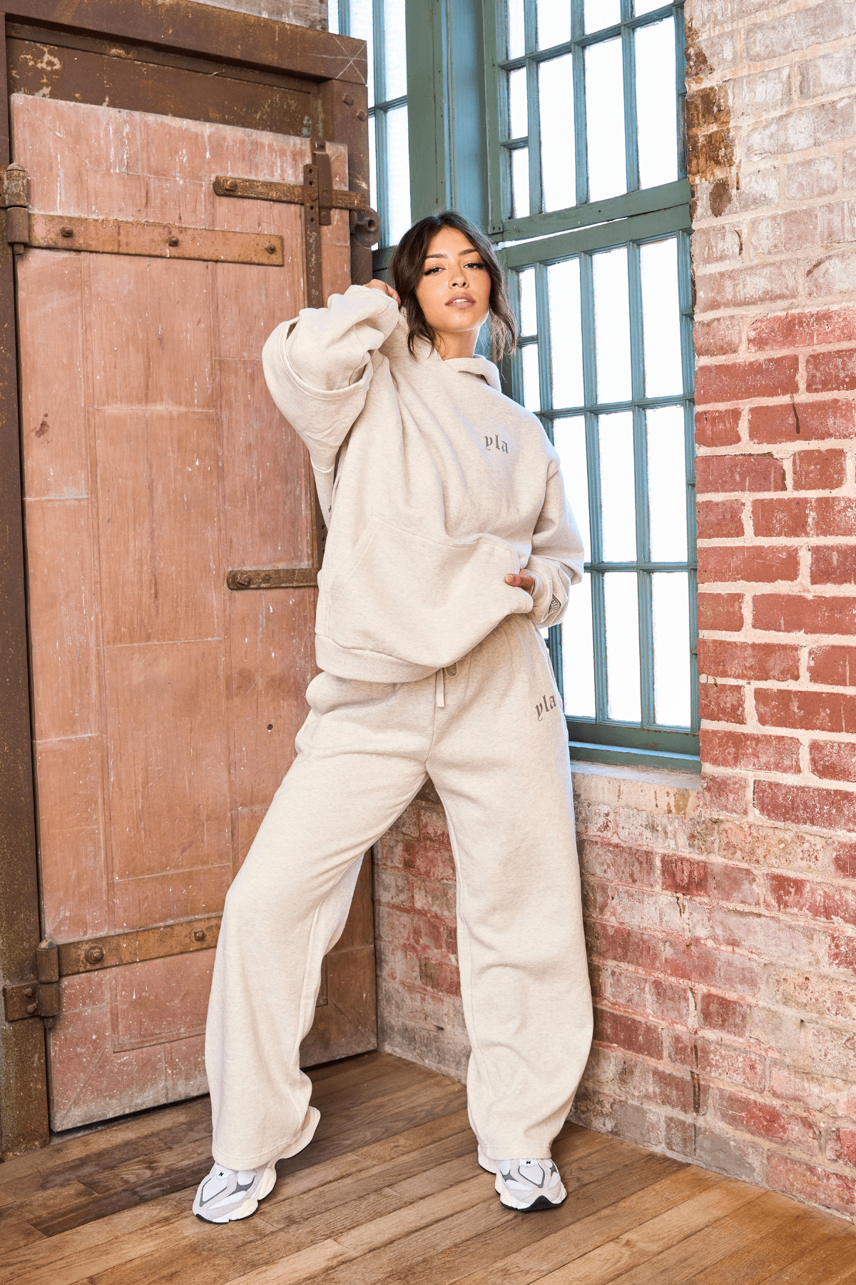 Side view of joggers for women, highlighting the straight leg design and YoungLA branding.