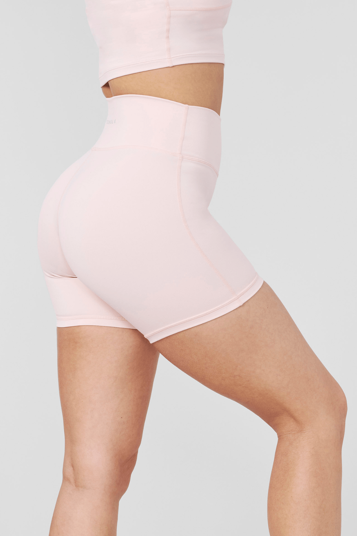 Back angle showing reflective logo and smooth waistline on biker shorts women style.
