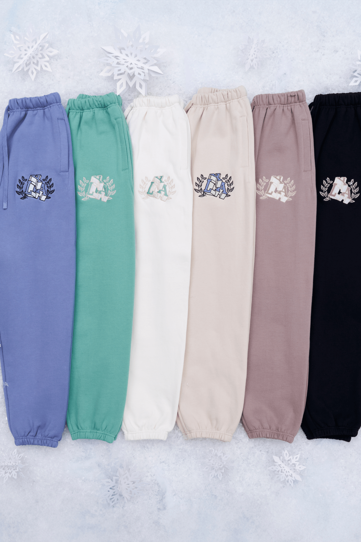 Side view of Teddy fleece joggers highlighting comfortable fit and embroidered logo