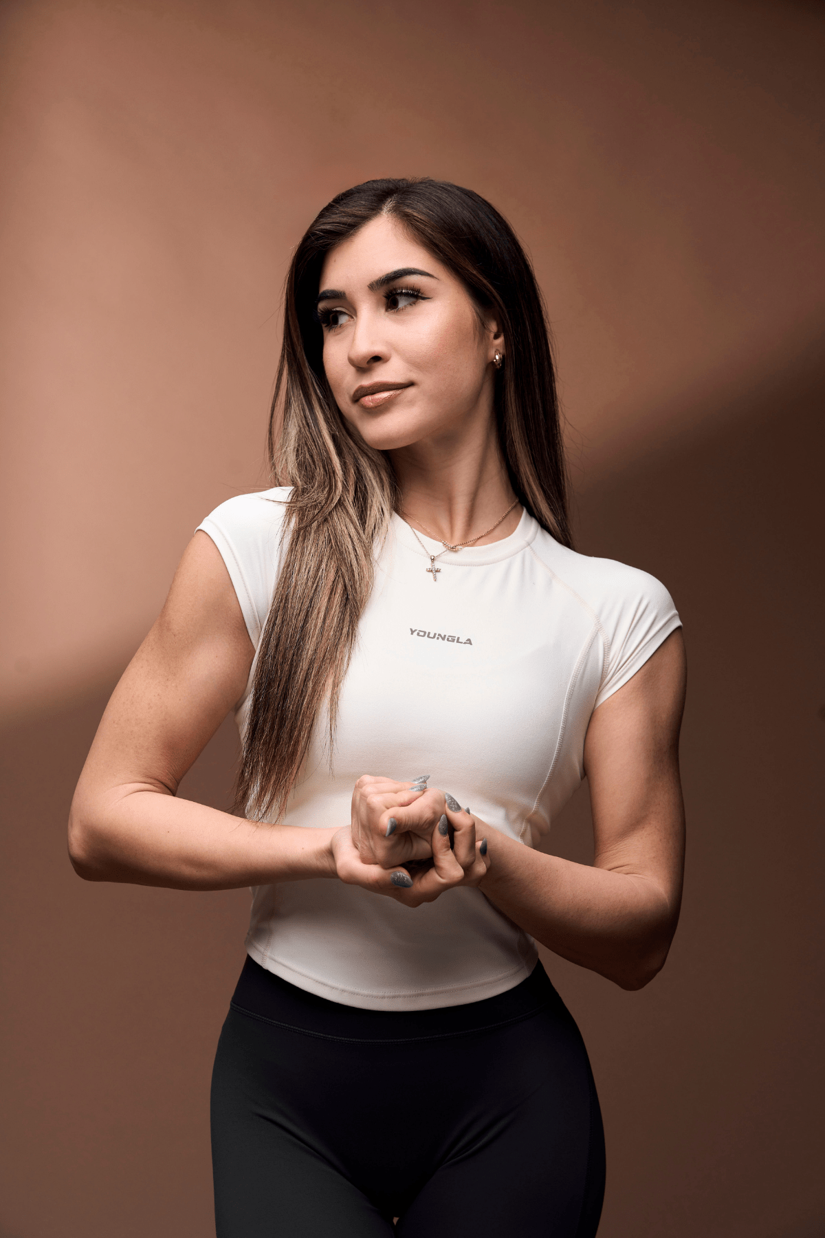 Close-up of the curved hem and cap sleeve design on a women’s workout tee