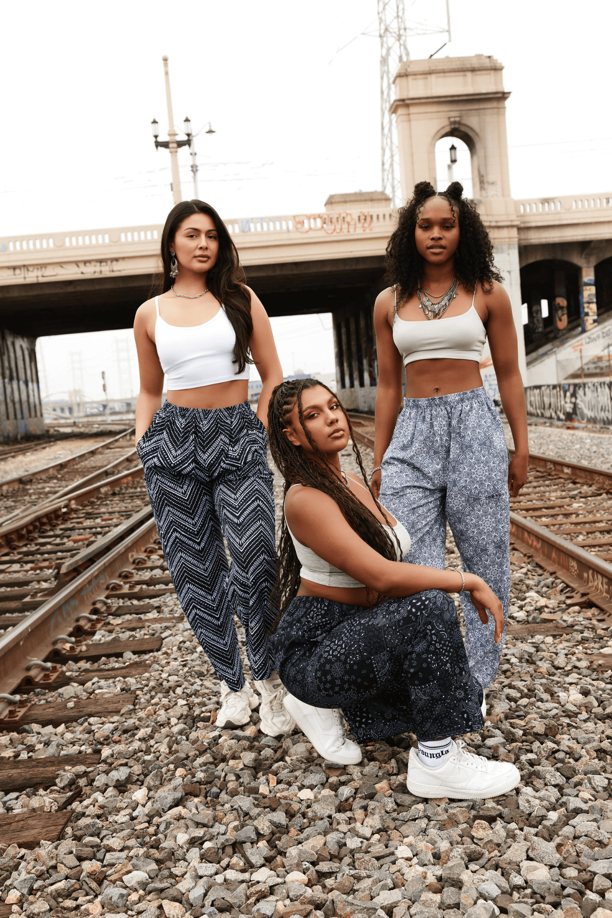 Front view of joggers styled with a crop top, worn in NYC streetwear fashion.