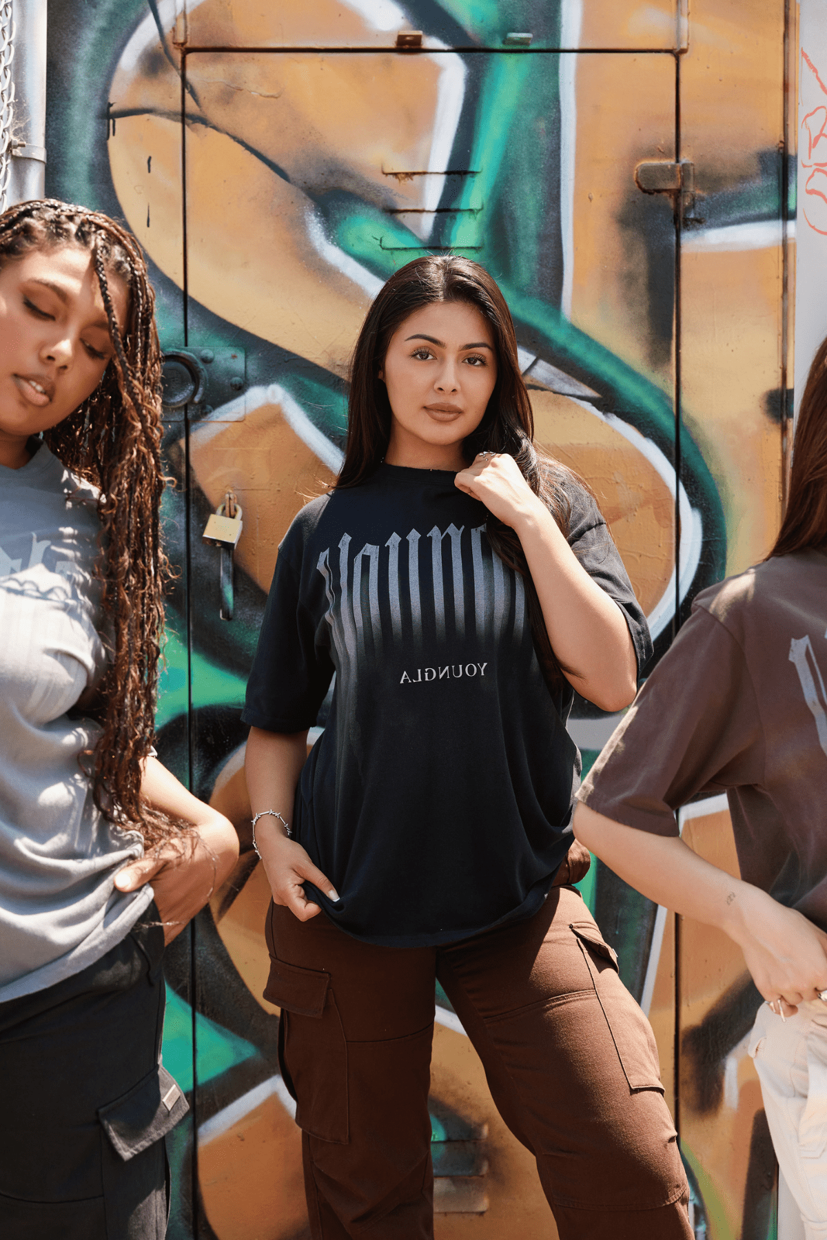 Model wearing the oversized T shirt with smoke print, paired with jeans for a relaxed look
