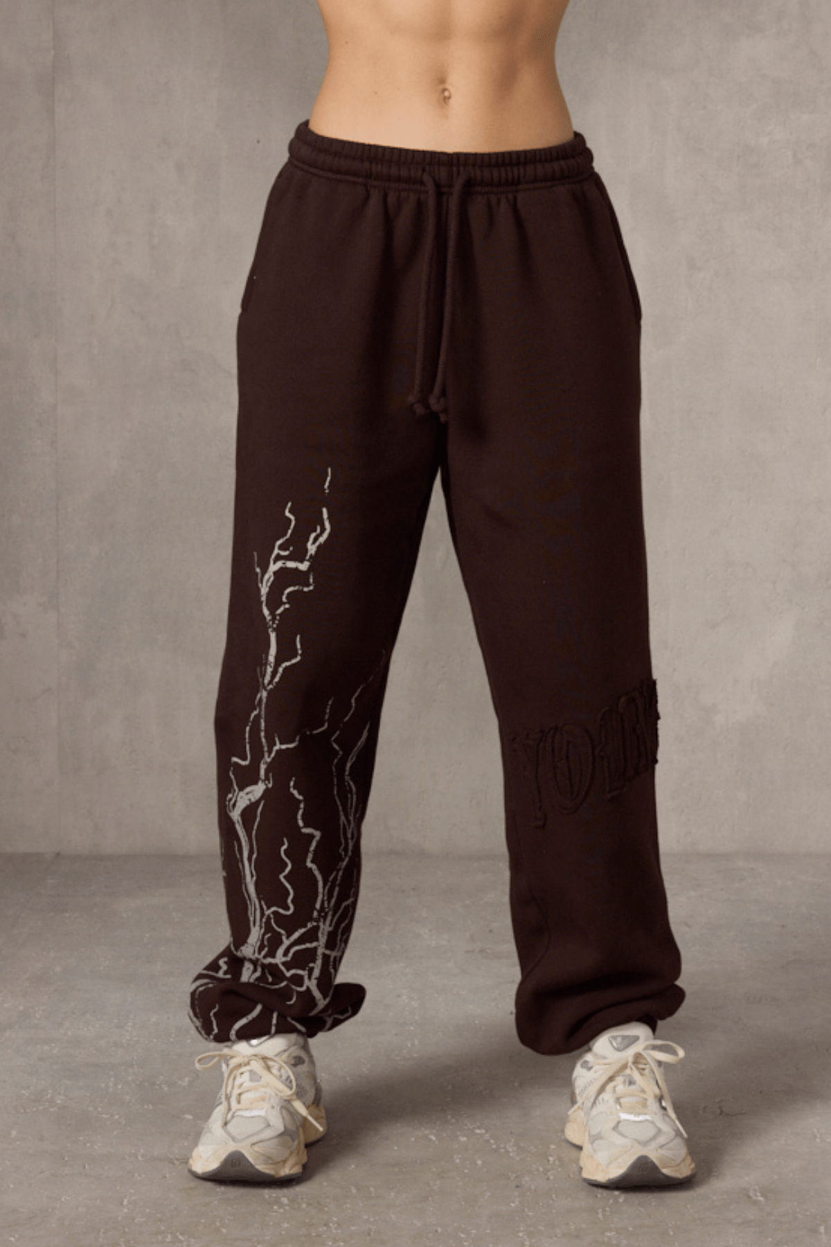 Front view of oversized cuff joggers with lightning design.