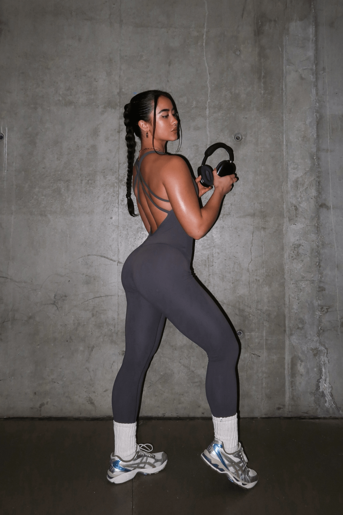 Model showcasing the athleisure romper in a workout setting.