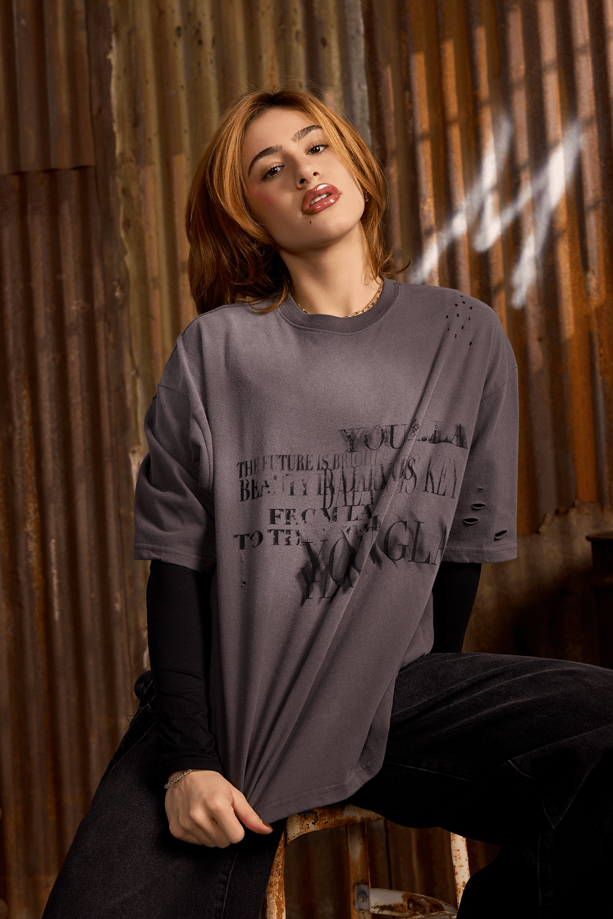 Street-style outfit featuring vintage graphic tee with slim-fit jeans