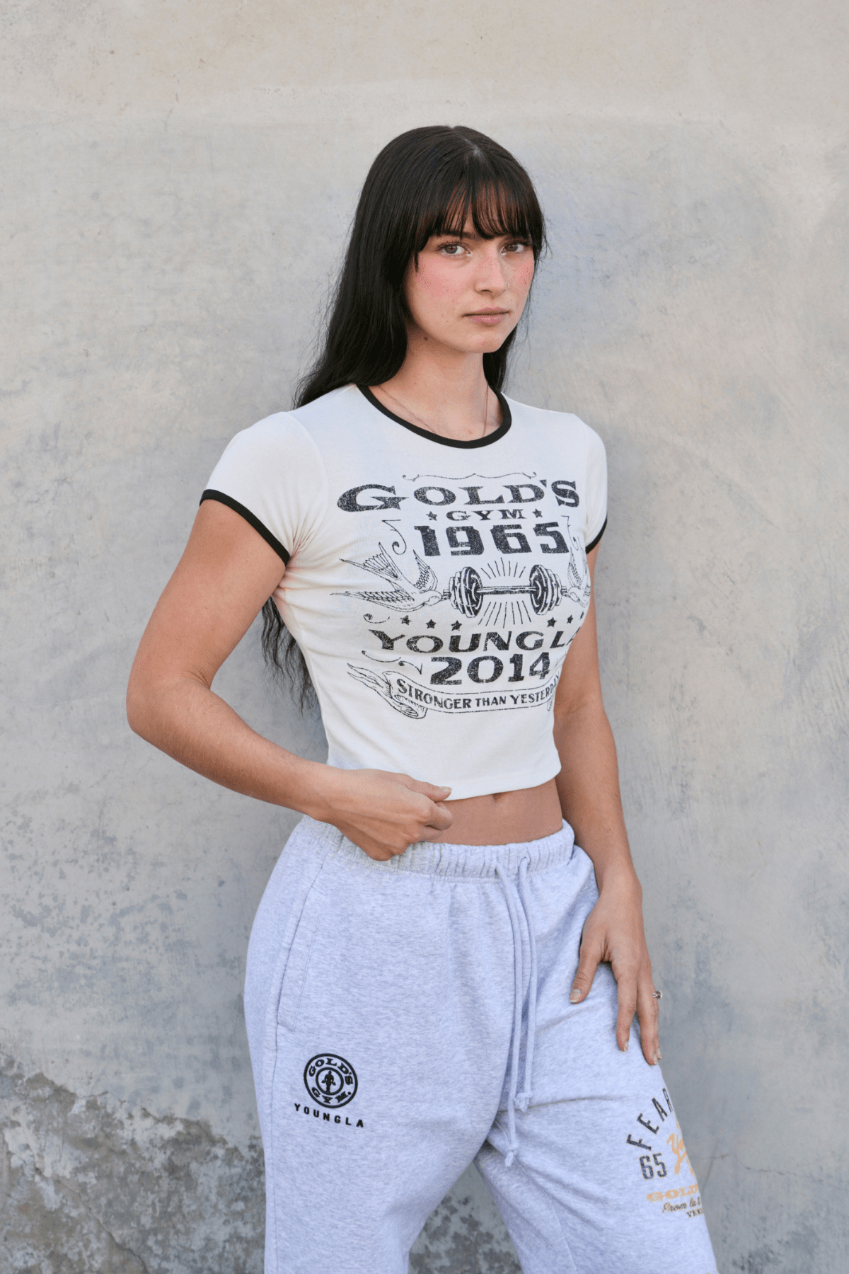Side angle of baby tee showing fitted silhouette and cotton texture