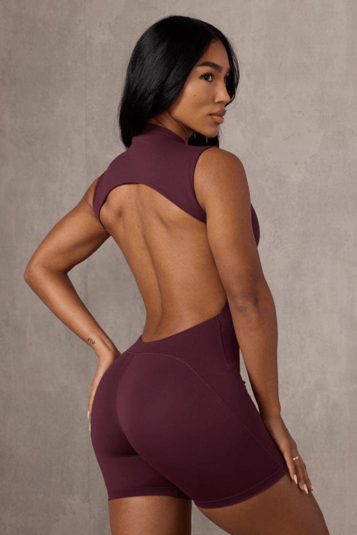 Close-up of the backless black rompers sleek nylon-spandex fabric