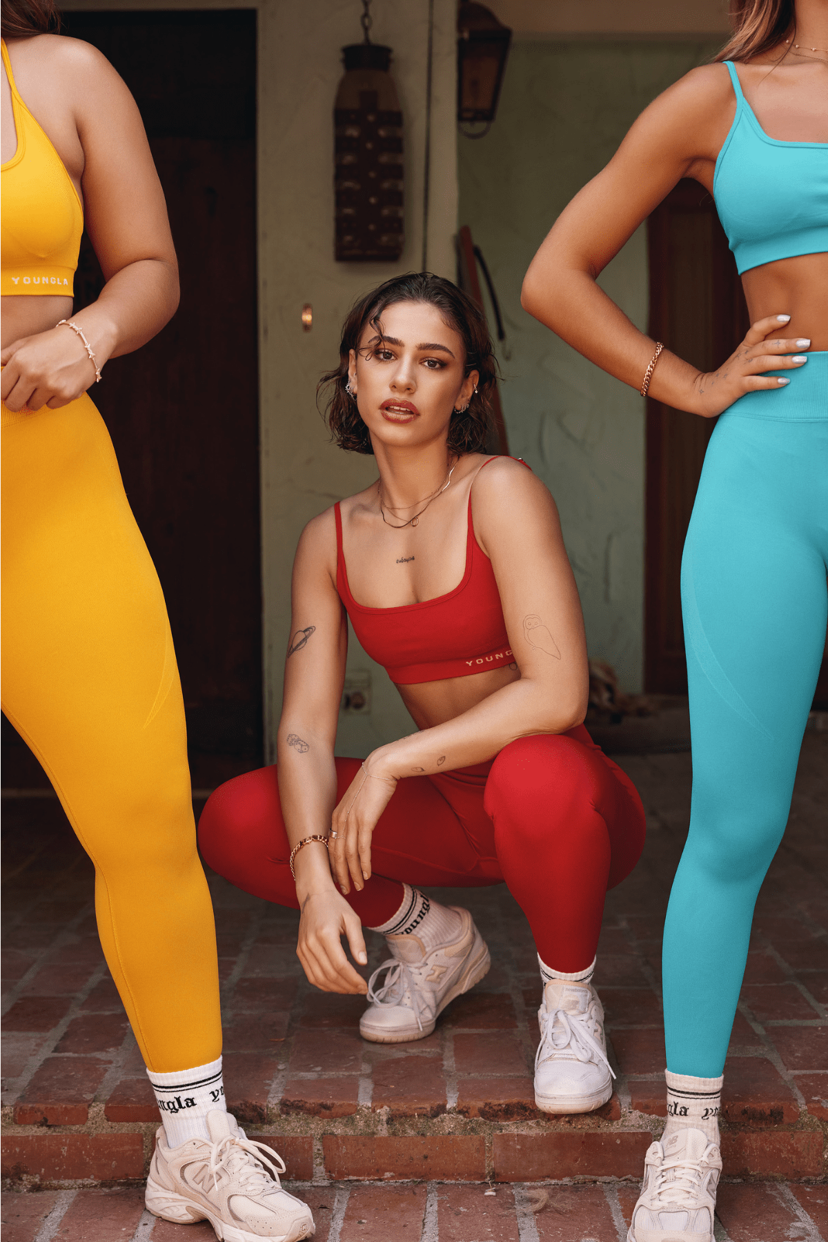 Model stretching outdoors wearing CurveFit leggings – fitness leggings for summer comfort